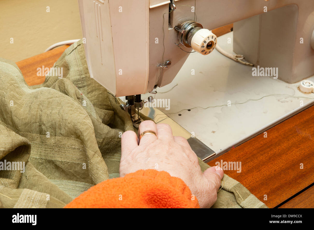 woman sewing clothes in a sewing machine Stock Photo Alamy