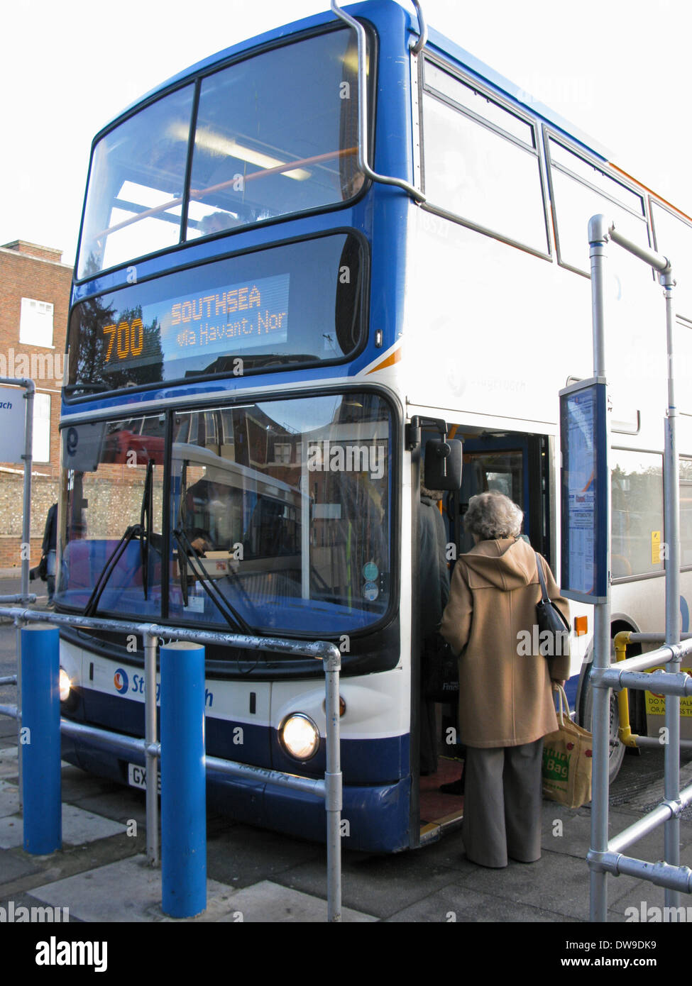 People boarding a 700 Coastliner Stagecoach bus at Chichester bus station West Sussex UK Stock Photo