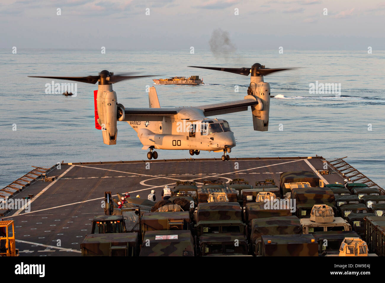 A US Marines V-22 Osprey transport aircraft takes off from the flight deck of the USS Ashland during flight operations February 28, 2014 in the East China Sea. Stock Photo