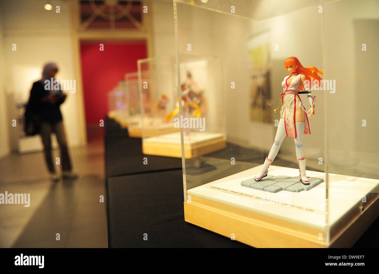 Jakarta, Indonesia. 4th Mar, 2014. A woman looks at a cartoon character during the Japanese Pop Culture Characters Exhibition in Jakarta, Indonesia, March 4, 2014. The exhibition is held from March 4 to March 23. © Zulkarnain/Xinhua/Alamy Live News Stock Photo