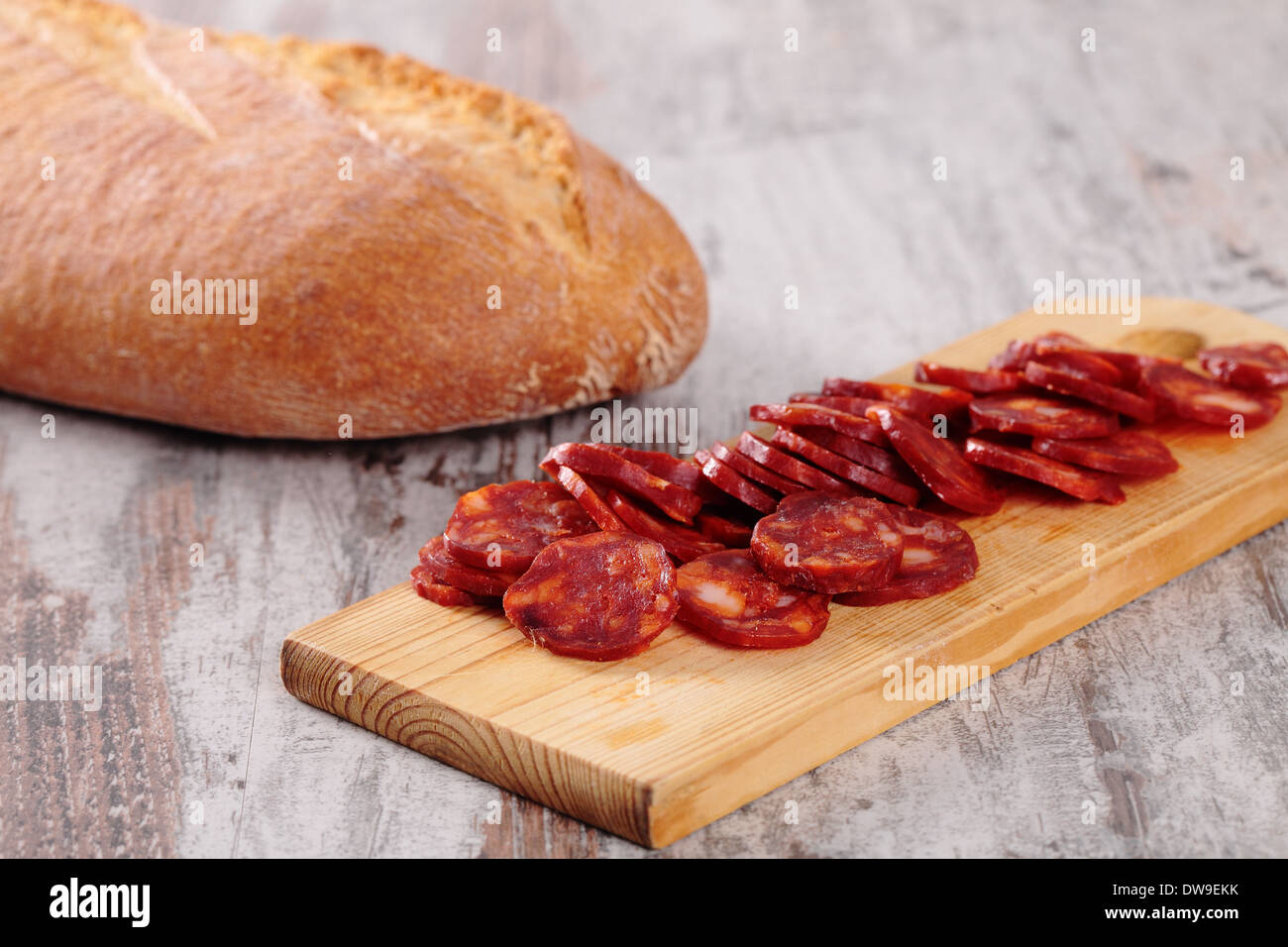 Sausage on a table and a bread tray Stock Photo Alamy