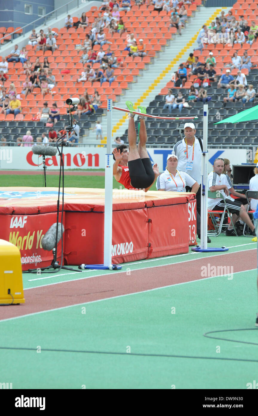 Athlete takes part in high jumping during the 2013 IAAF World Junior