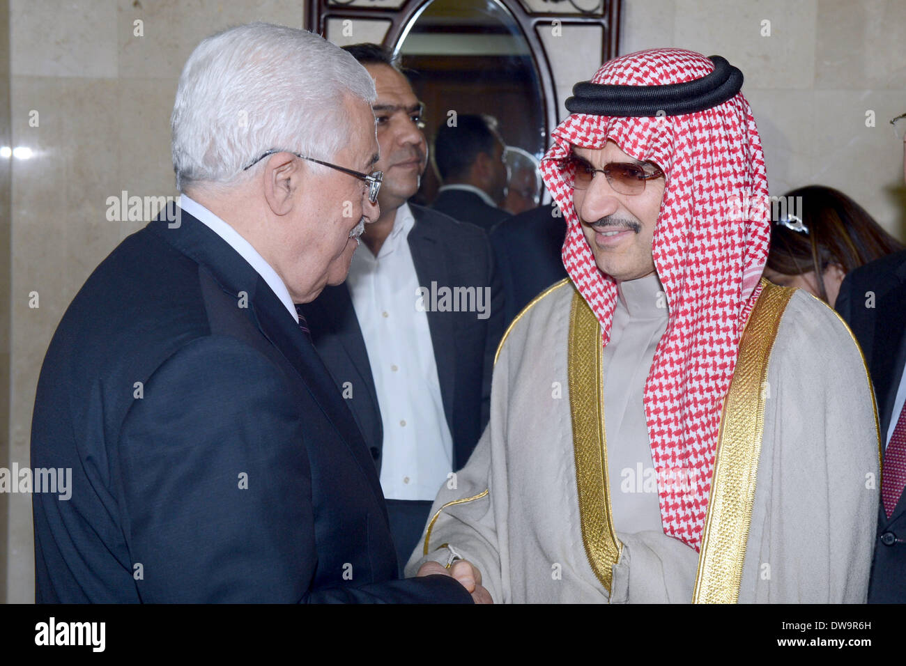 Ramallah, West Bank, Palestinian Territory. 4th Mar, 2014. Palestinian President Mahmud Abbas (R) shakes hands with Saudi Arabia's prince Al-Waleed bin Talal during their meeting in the West Bank city of Ramallah on March 4, 2014 Credit:  Thaer Ganaim/APA Images/ZUMAPRESS.com/Alamy Live News Stock Photo