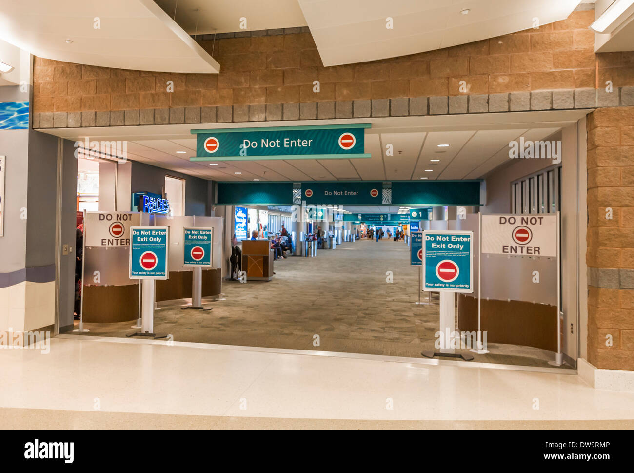 Signs tell visitors not to enter gate at Pensacola International Airport in Pensacola, Florida Stock Photo