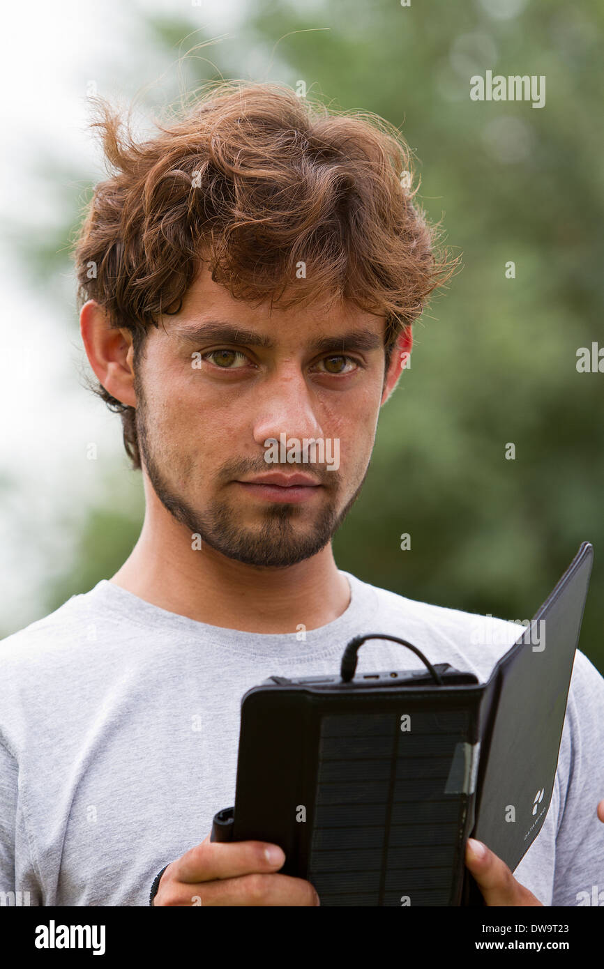 Afghan student using a solar powered tablet Stock Photo