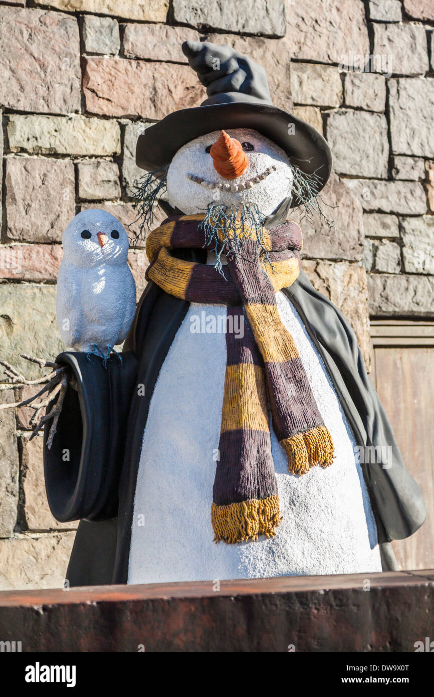Snowman with owl in The Wizarding World of Harry Potter at Universal Studios Islands of Adventure Stock Photo