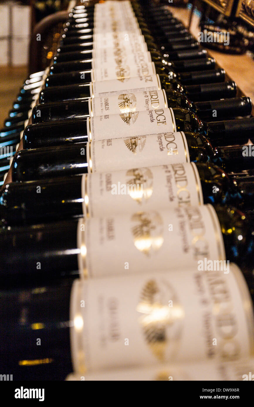 Bottles of Chablis white wine on shelves at the Lakeridge Winery and