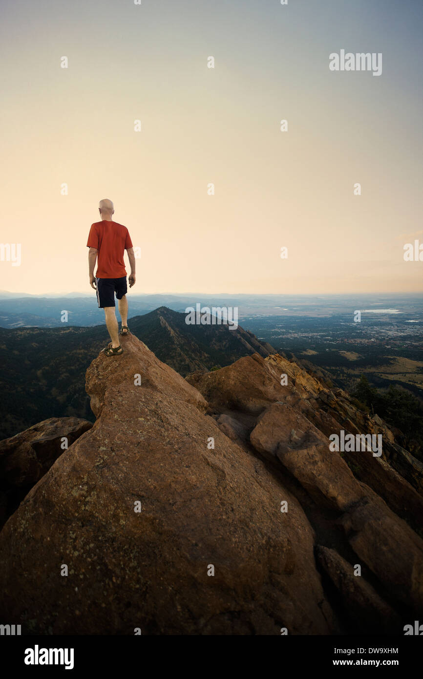 Mature male hiker standing on top of rock formation, Boulder, Colorado, USA Stock Photo