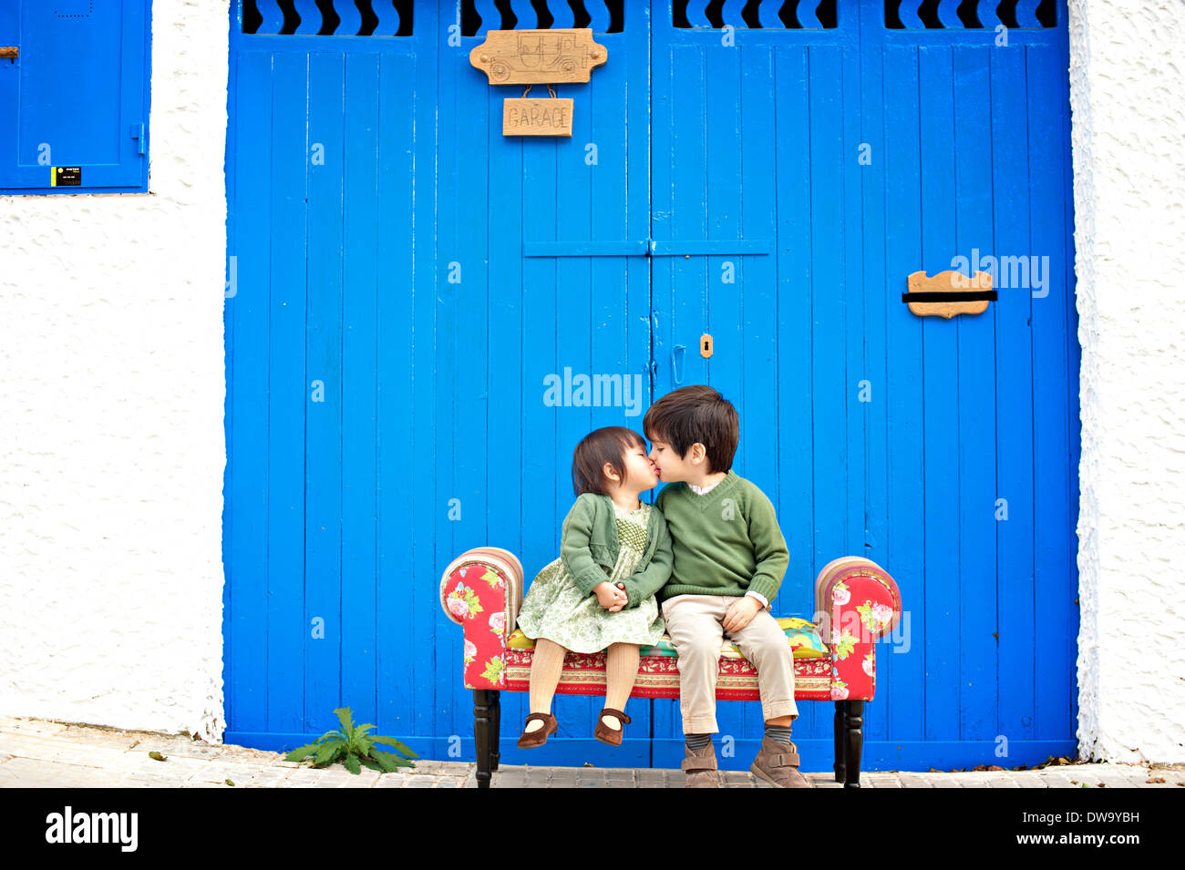 Two young kids kiss in hi-res stock photography and images - Alamy