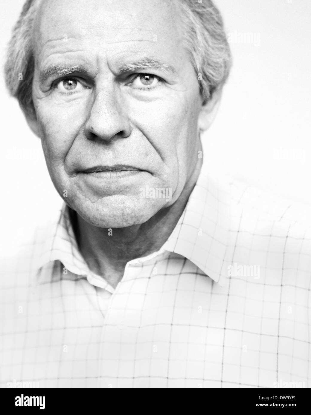 Black and white studio portrait of serious senior man Stock Photo