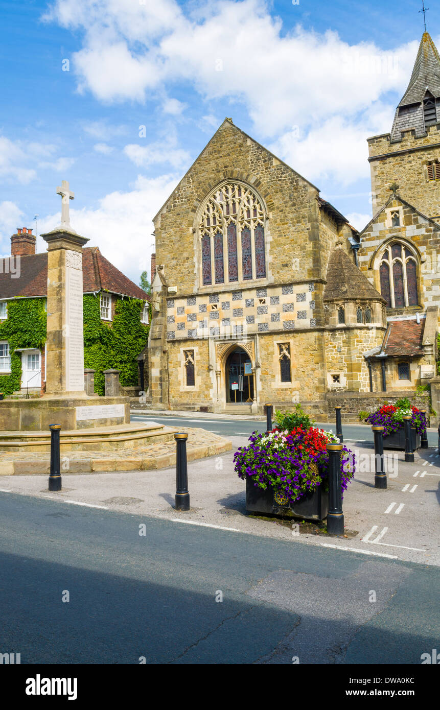 The war memorial and St Mary Magdalene & St Denys Church in Midhurst, West Sussex, England Stock Photo
