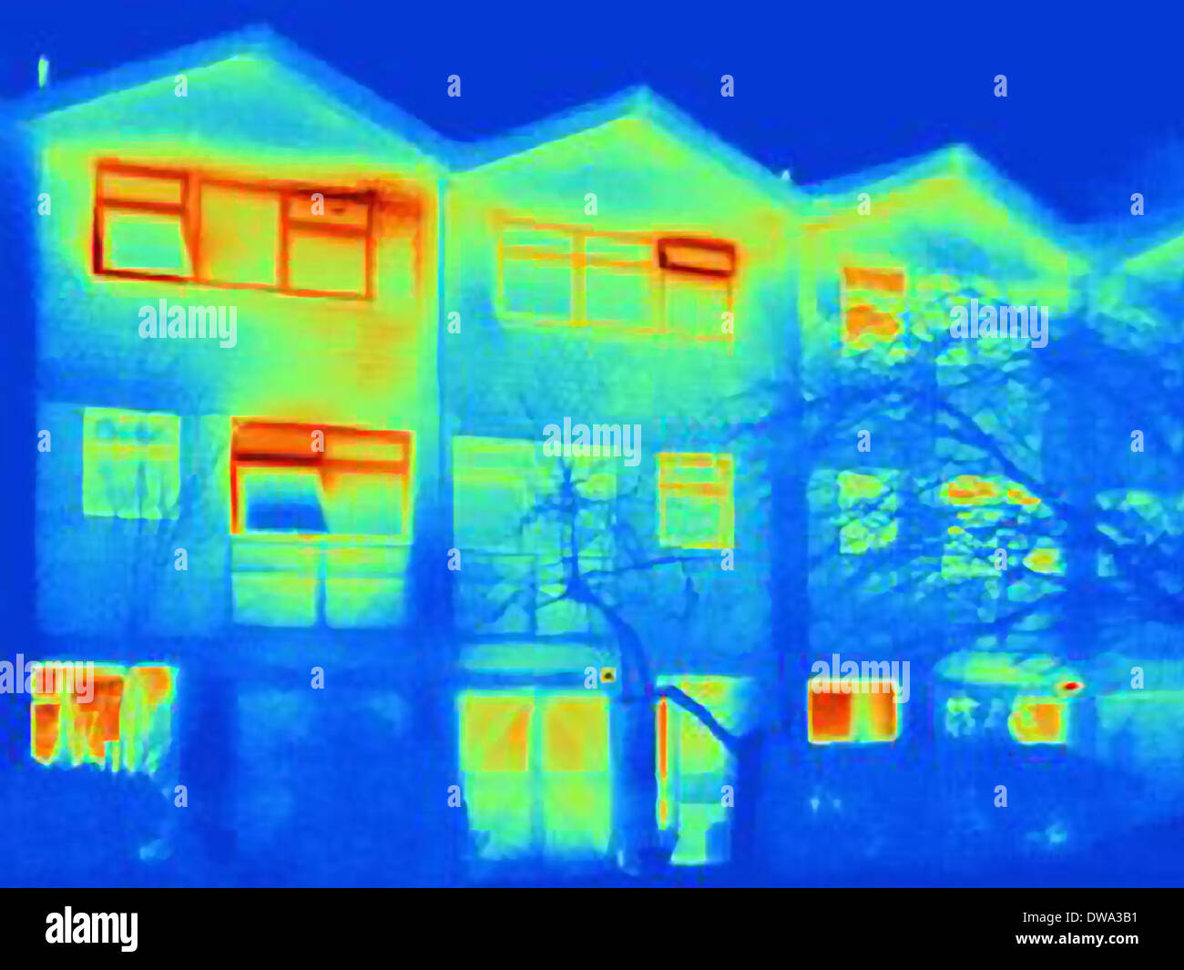 Thermal image of house, showing loss of heat from open windows Stock