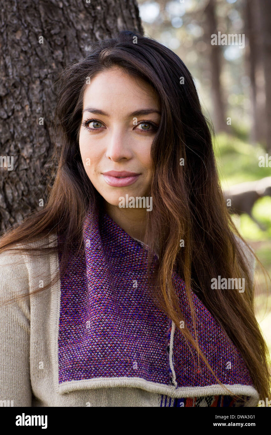 Portrait of young woman with long brown hair Stock Photo