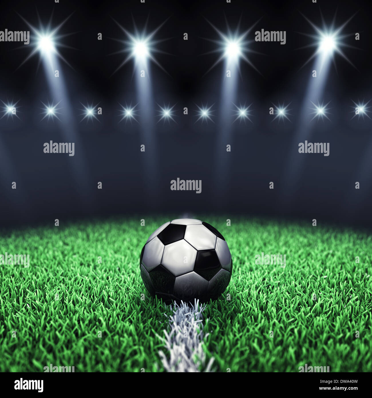 Soccer arena and ball with floodlights Stock Photo