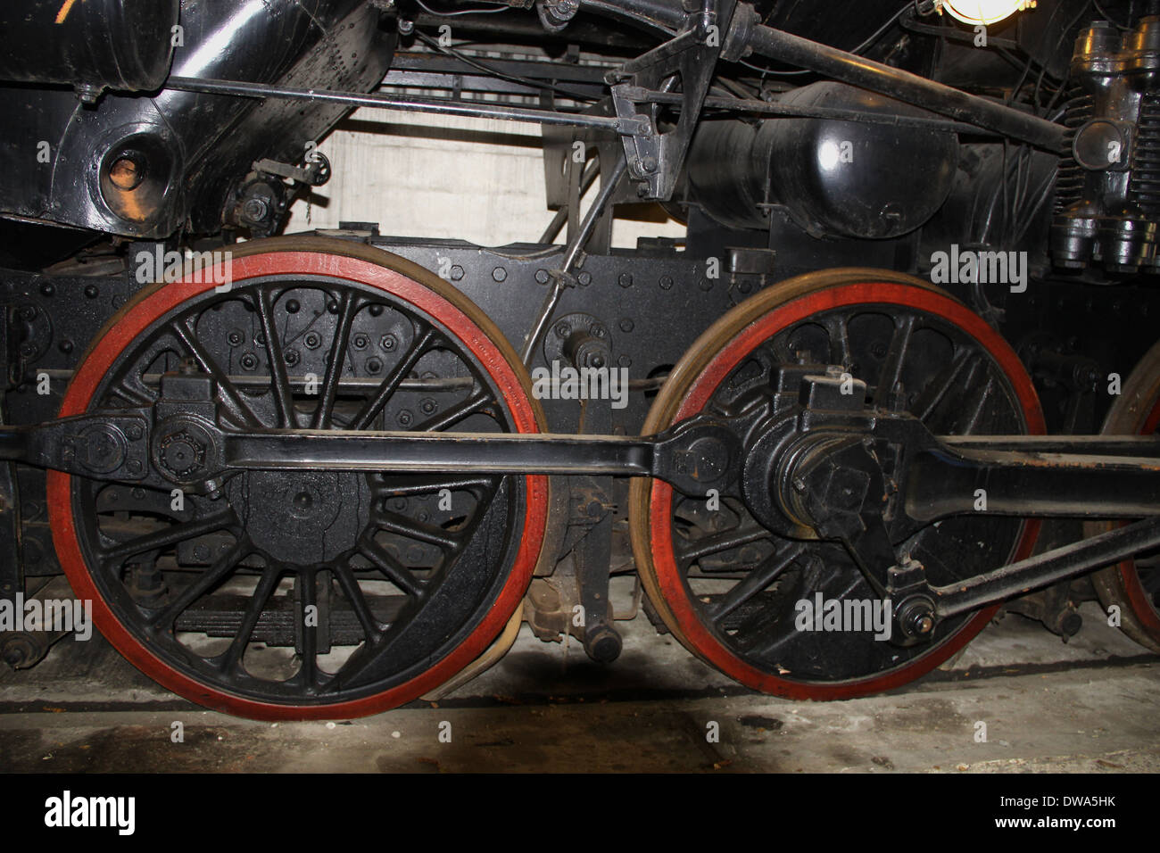Driving wheels on old steam train Stock Photo