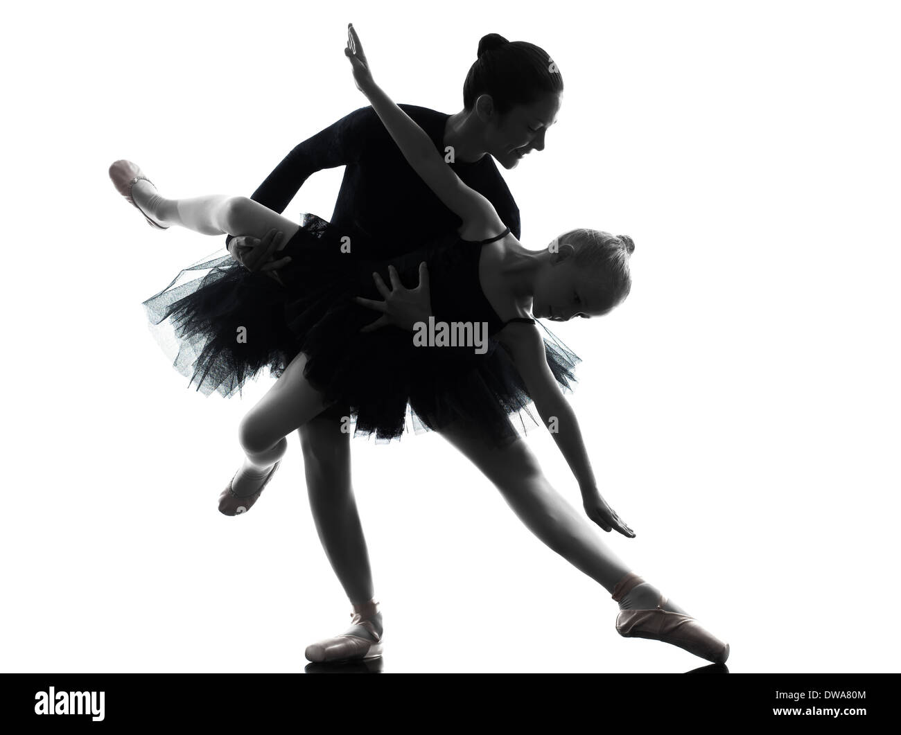 woman and little girl ballerina ballet dancer dancing in silhouette on
