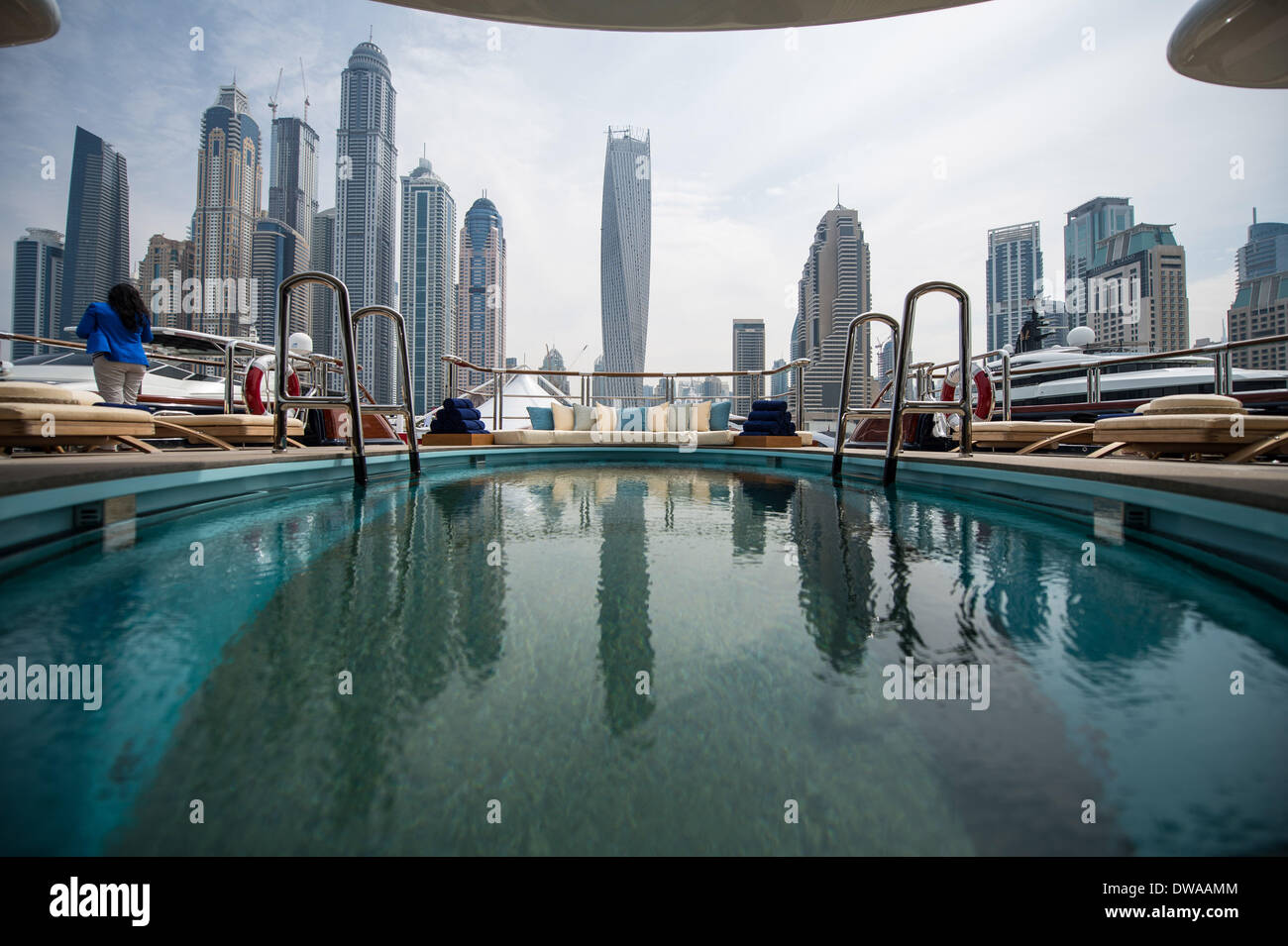 Dubai, United Arab Emirates. 4th Mar, 2014. Skyscrapers in Dubai Marina area are reflected by the water in a pool on the 88.5-meter-long Oceanco's Nirvana yacht which is the largest luxury yacht ever displayed in Dubai, on the Dubai international Boat Show 2014 held at the Dubai International Marine Club, Dubai, the United Arab Emirates, on March 4, 2014. The show starting on Tuesday has 430 boats worth 1.8 billion Dirham or 490.8 million dollars on display amid rising interest from wealthy yacht aficionados from abroad. © Pan Chaoyue/Xinhua/Alamy Live News Stock Photo