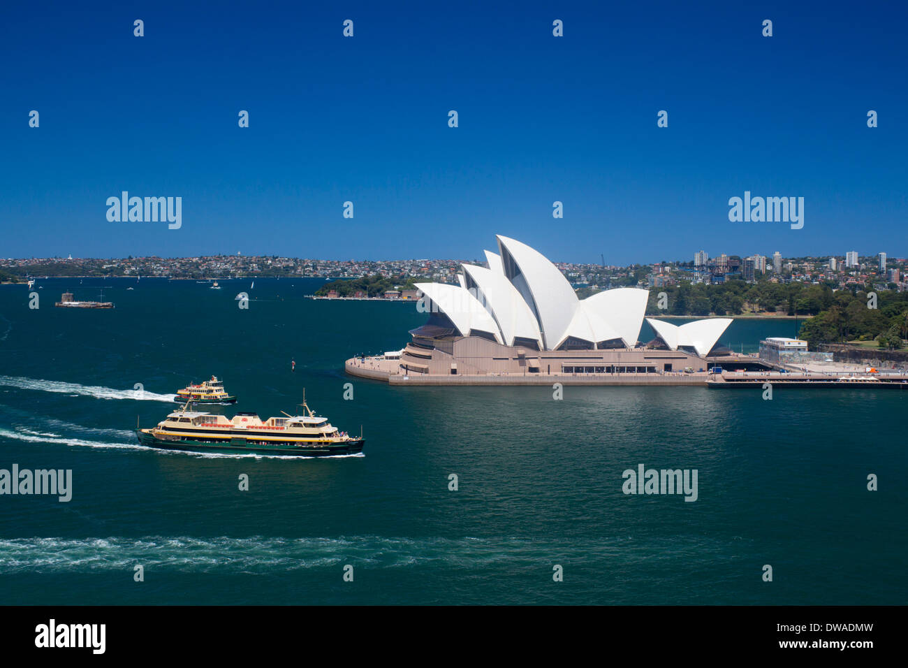 Sydney Opera House and Harbour from Harbour Bridge with ferries passing Sydney NSW Australia Stock Photo