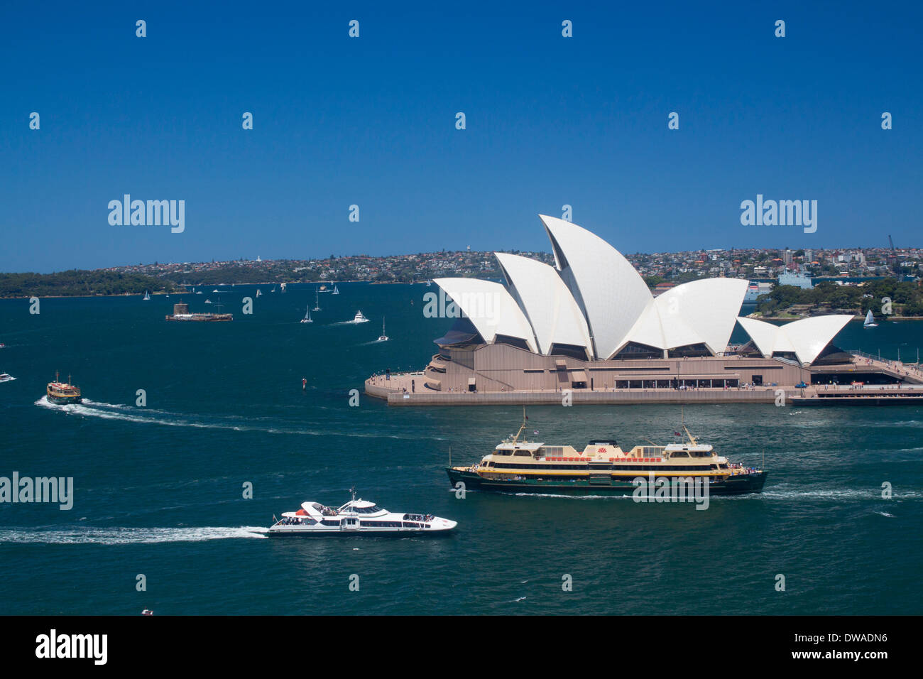 Sydney Opera House and Harbour from Harbour Bridge with ferries passing Sydney NSW Australia Stock Photo