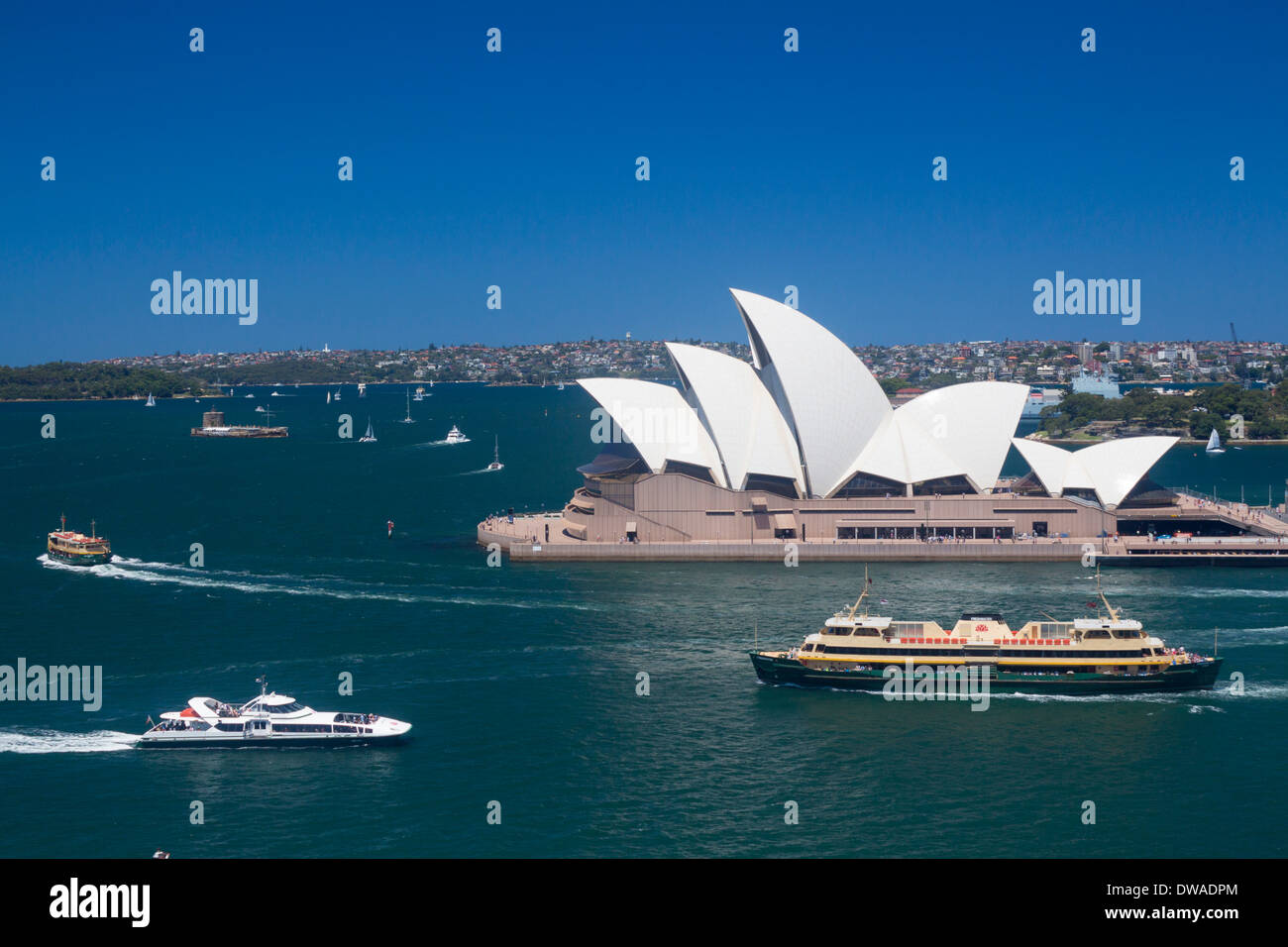 Sydney Opera House and Harbour from Harbour Bridge with ferries passing Sydney NSW Australia Stock Photo