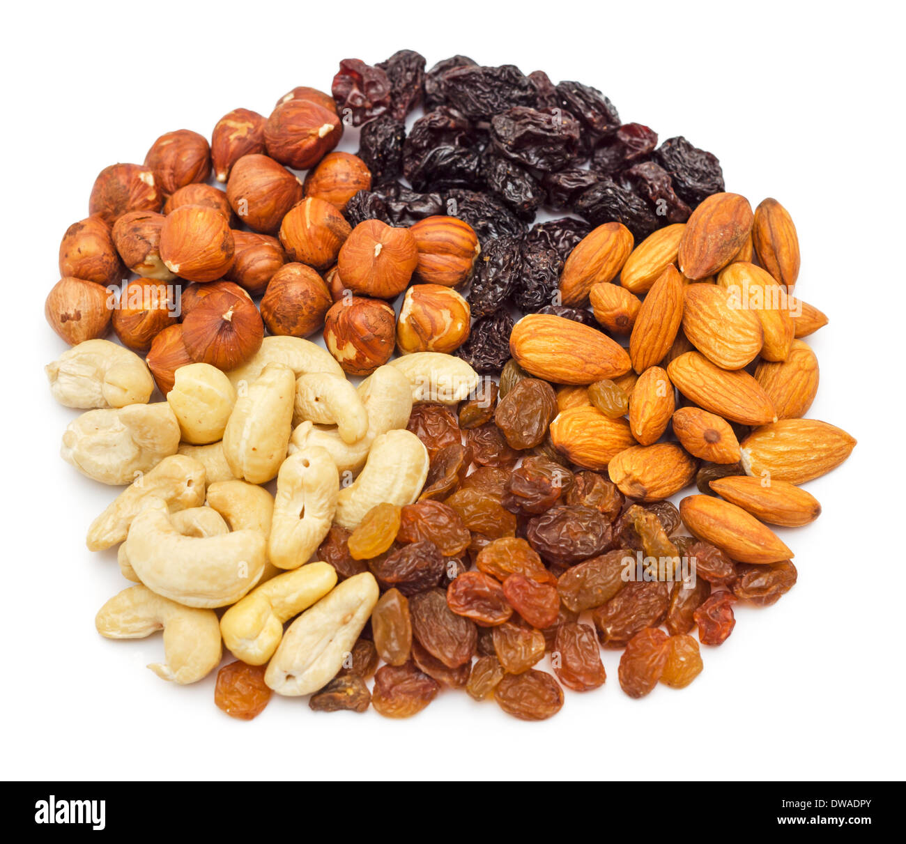 Mixed nuts and dry fruits pile isolated on white background Stock Photo