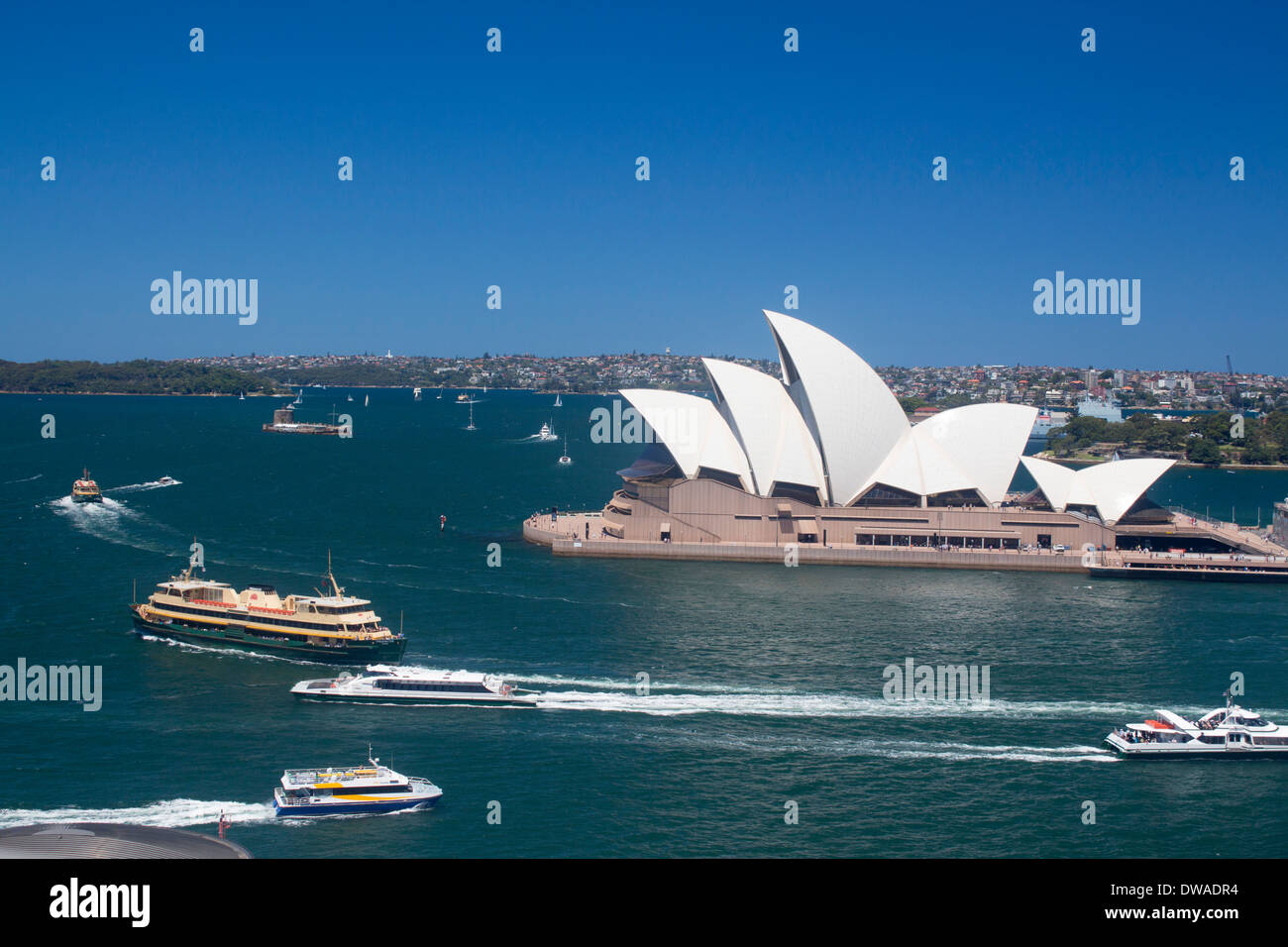 Sydney Opera House and Harbour from Harbour Bridge with ferries passing Sydney NSW Australia Stock Photo