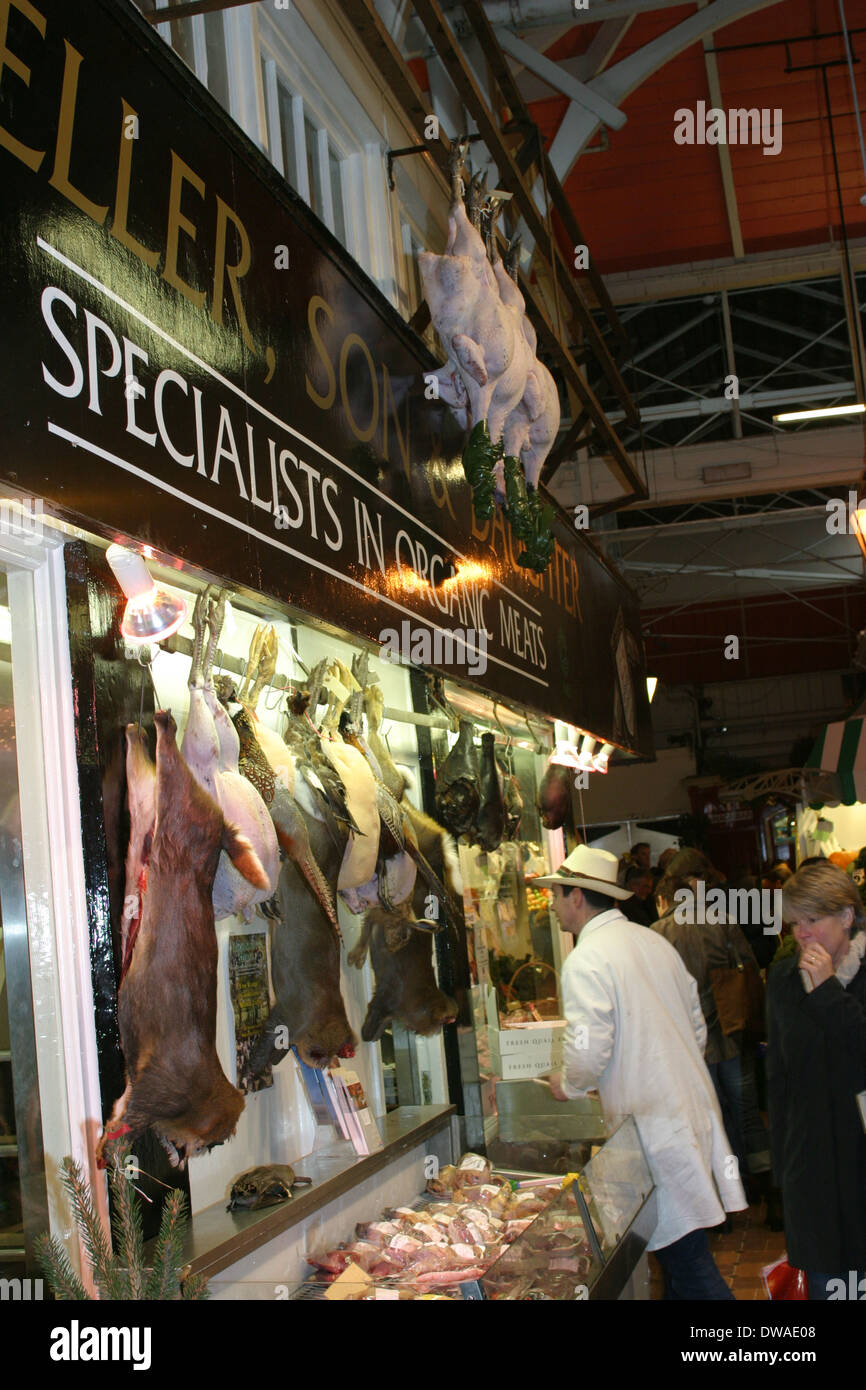 A butchers stall at Oxford covered market, specialising in game
