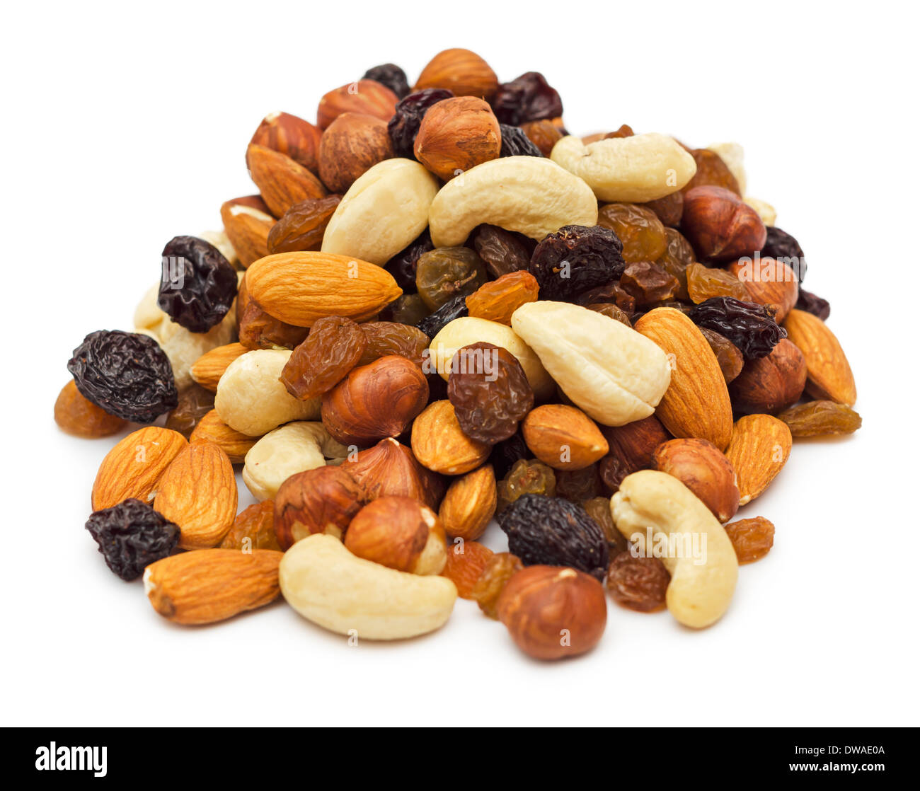 Mixed nuts and dry fruits pile isolated on white background Stock Photo