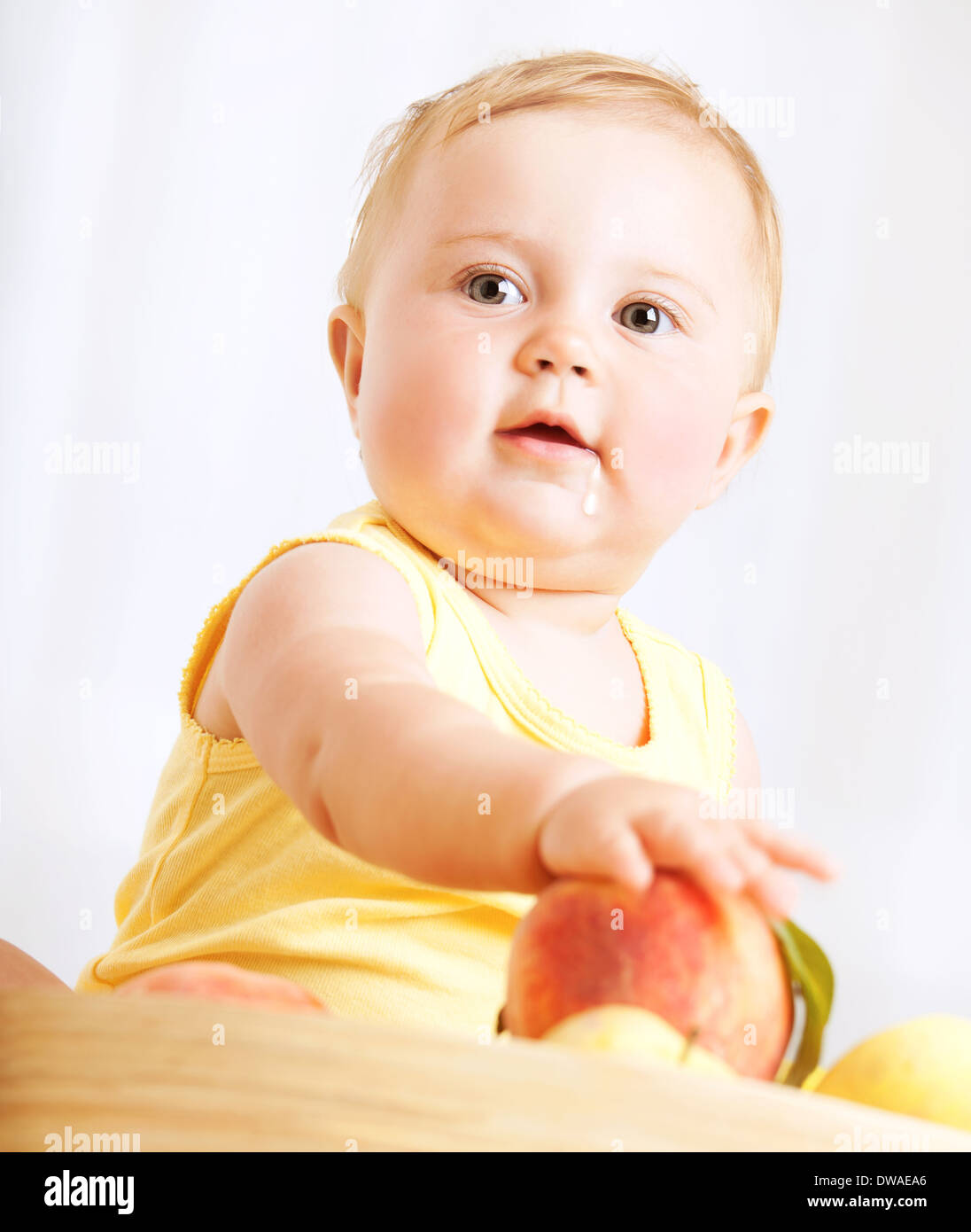 Happy Little Baby Girl Eating Fresh Tasty Fruits For Lunch Enjoying Healthy Food At Home Organic Nutrition For Kids Stock Photo Alamy