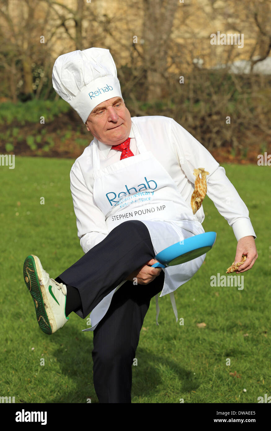 London, UK. 4th March, 2014. Photo shows Stephen Pound MP Lords Team Flips to Victory in Incredibly Eggs-citing Last-Minute Scramble at Rehab Parliamentary Pancake Race The Lords team, which has not won the race since 2011, was victorious and finished the relay event in a time of 3 minutes and 56 seconds. The parliamentary tradition, which has been running for 17 years, sees teams of MPs, Lords and members of the Parliamentary Press Gallery compete against each other. Credit:  Oliver Dixon/Alamy Live News Stock Photo