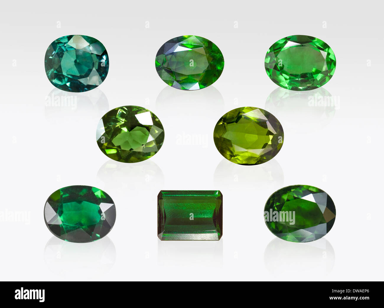 Green Tourmaline gemstones on white background Stock Photo