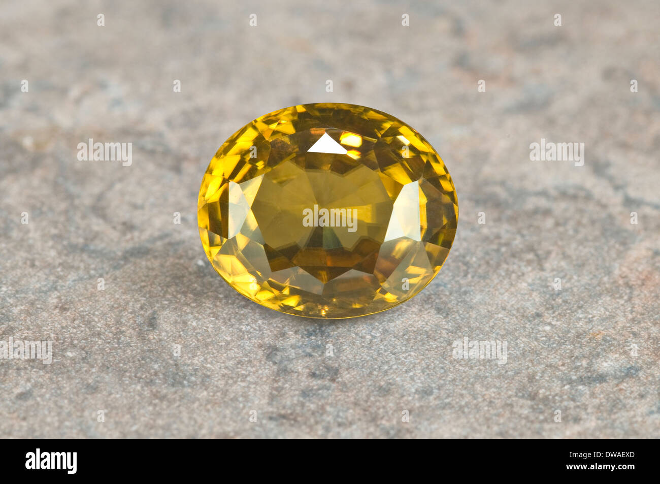 Yellow Zircon Gemstone on marble Stock Photo