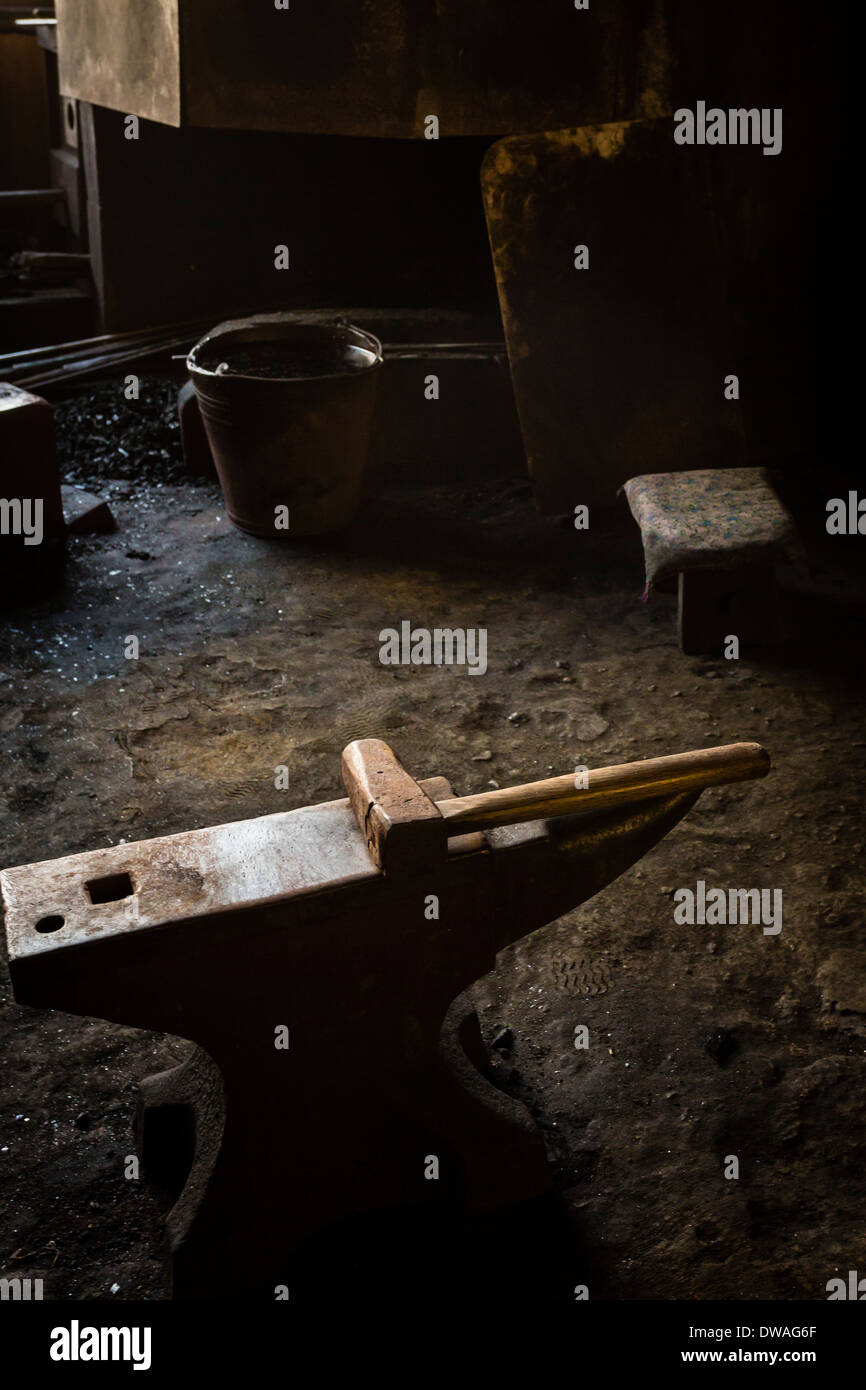 The main tools of a sword forger: an anvil and hammer Stock Photo