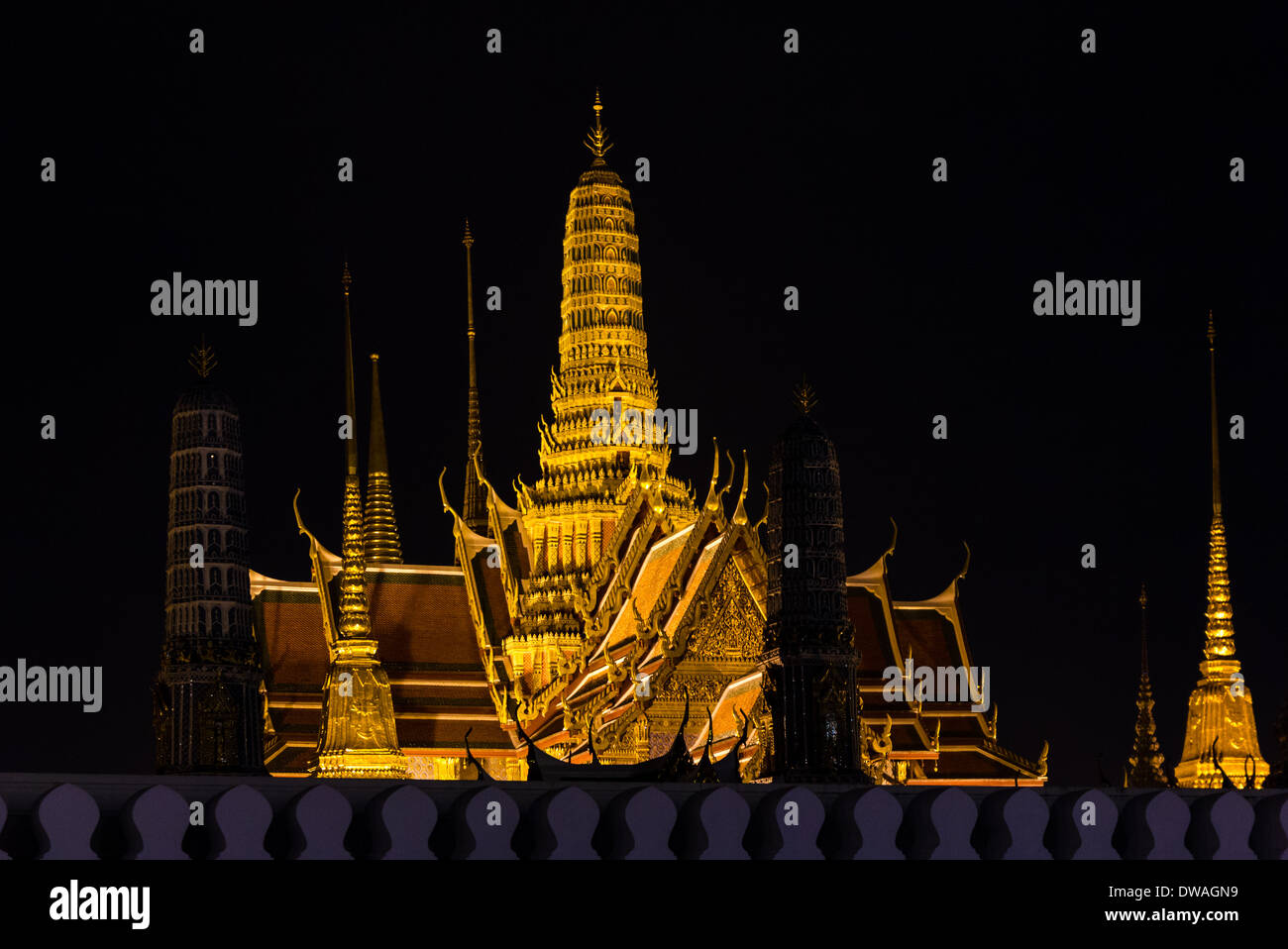 Night Shot of Bangkok's illuminated Grand Palace from the Street outside Stock Photo