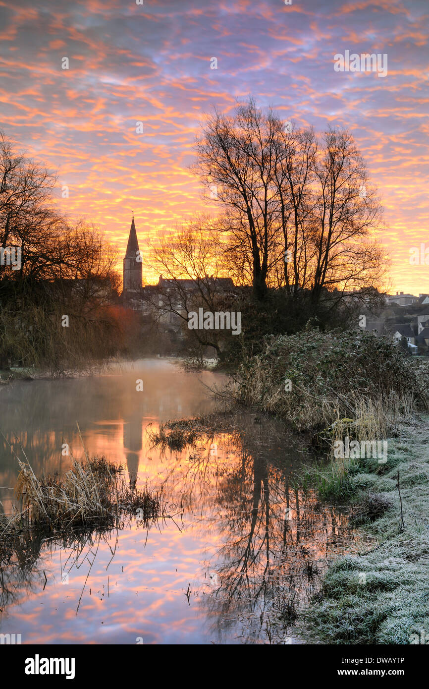 Malmesbury, Wiltshire, UK. 5th March, 2014. The first rays of an early March sunrise light up the sky over the Wiltshire hillside town of Malmesbury. Credit:  Terry Mathews/Alamy Live News Stock Photo