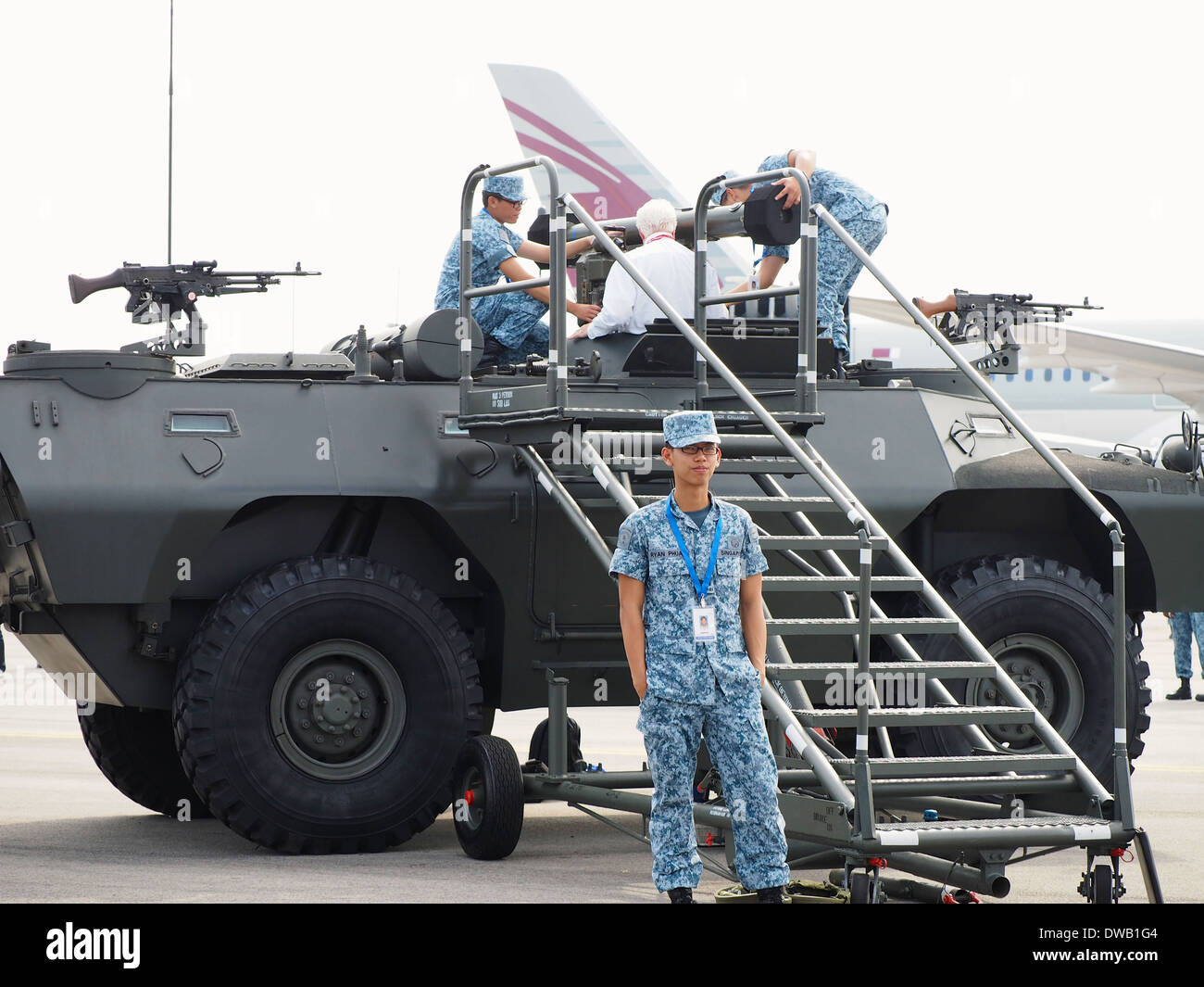 Static display of the RSAF V200 and a mounted RBS70 SAM manned by national service personnel at the 2014 Singapore Airshow Stock Photo