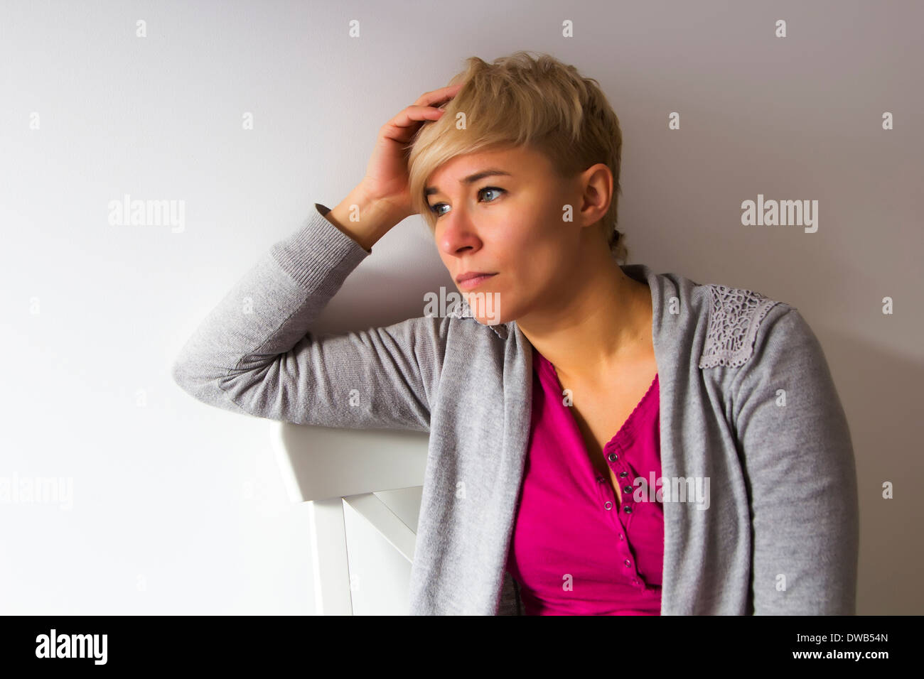 young woman with sad expression on her face Stock Photo