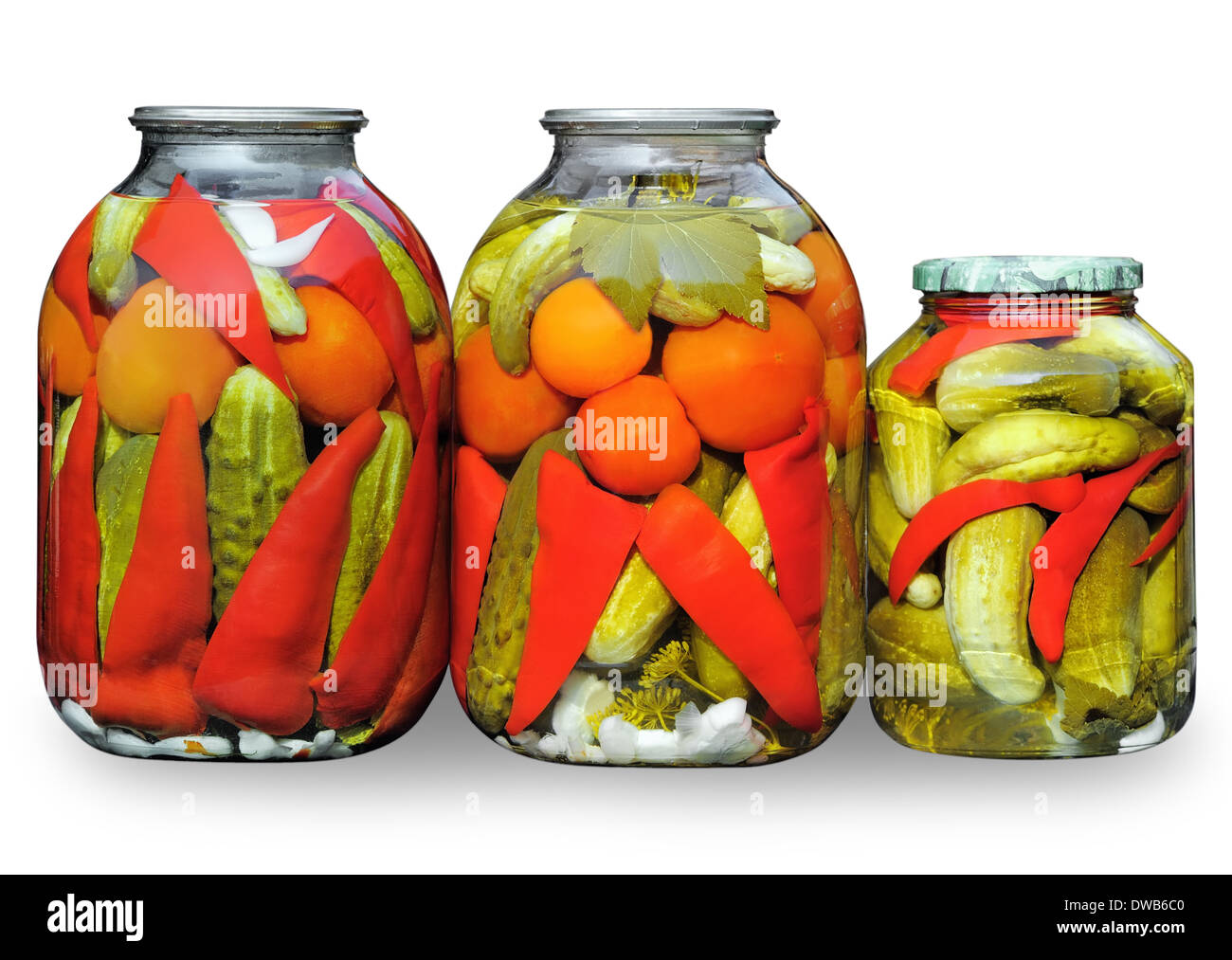 Homemade pickled vegetables. Assorted in glass jars Stock Photo