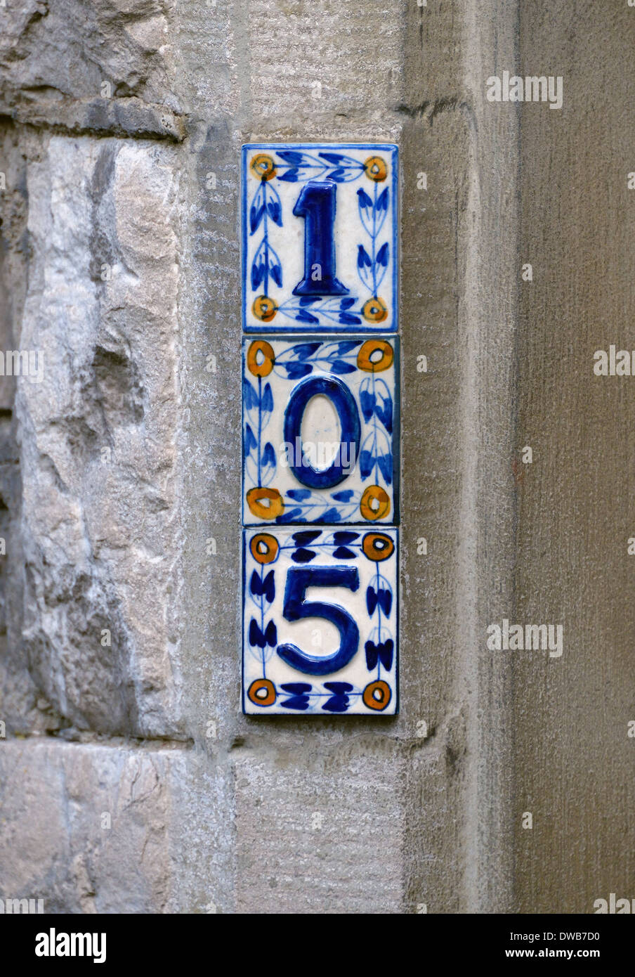 Number 105. House number on ceramic tiles. Stock Photo