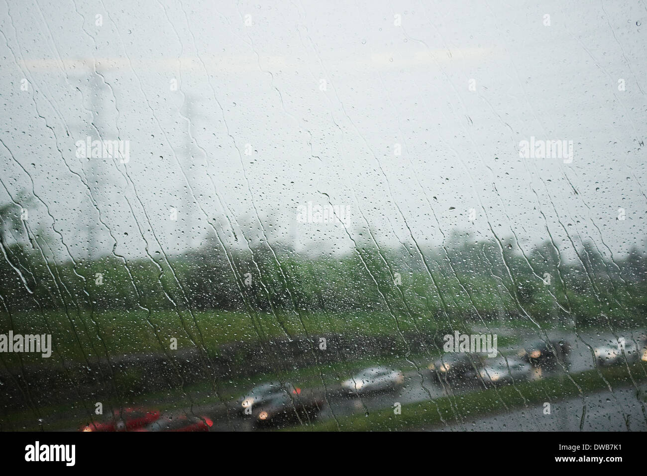 View through window of highway and traffic on a rainy day Stock Photo