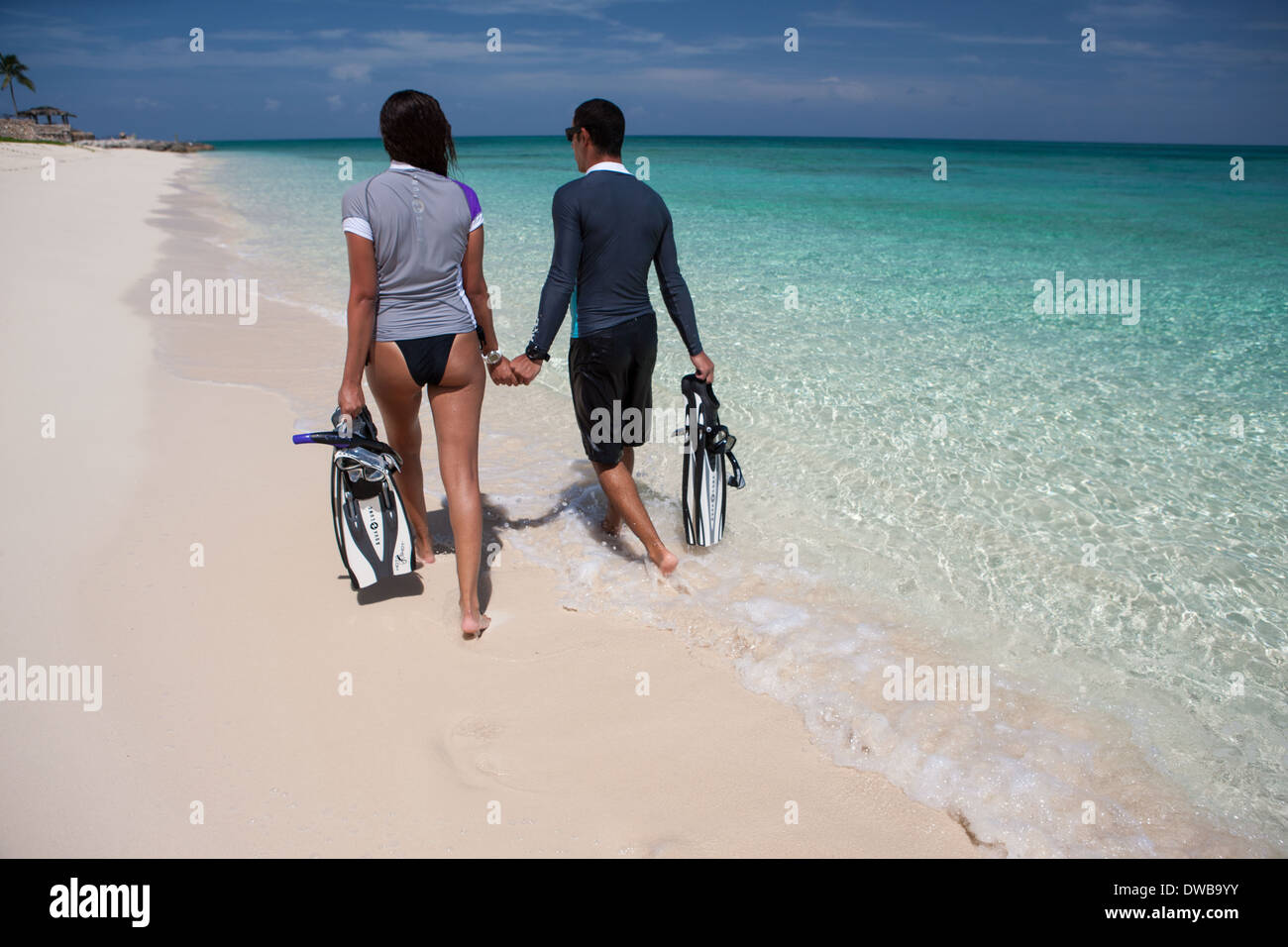 Man walking on caribbean beach hi-res stock photography and images - Alamy