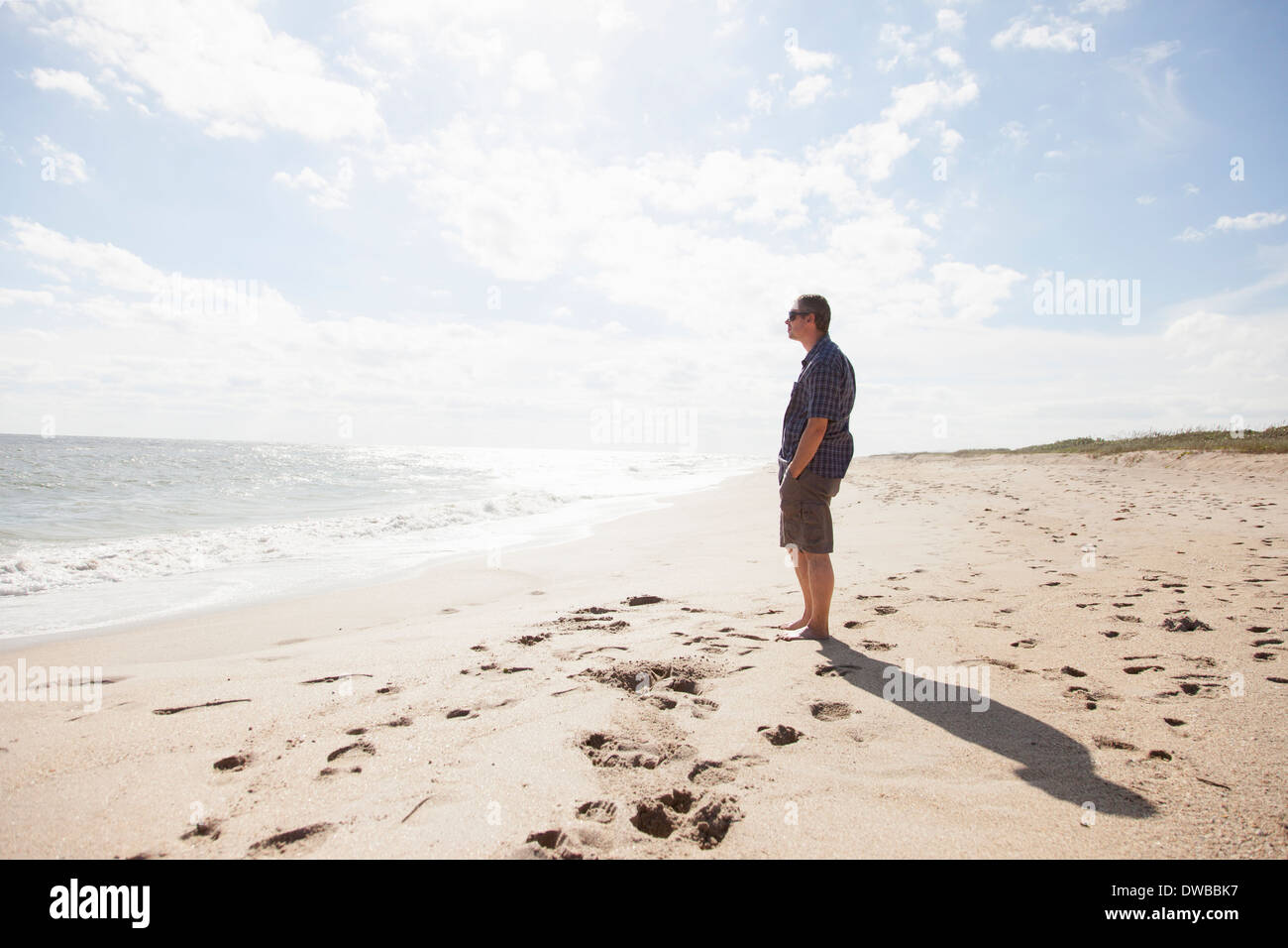 Man looking out to sea, Satellite Beach, Florida, US Stock Photo