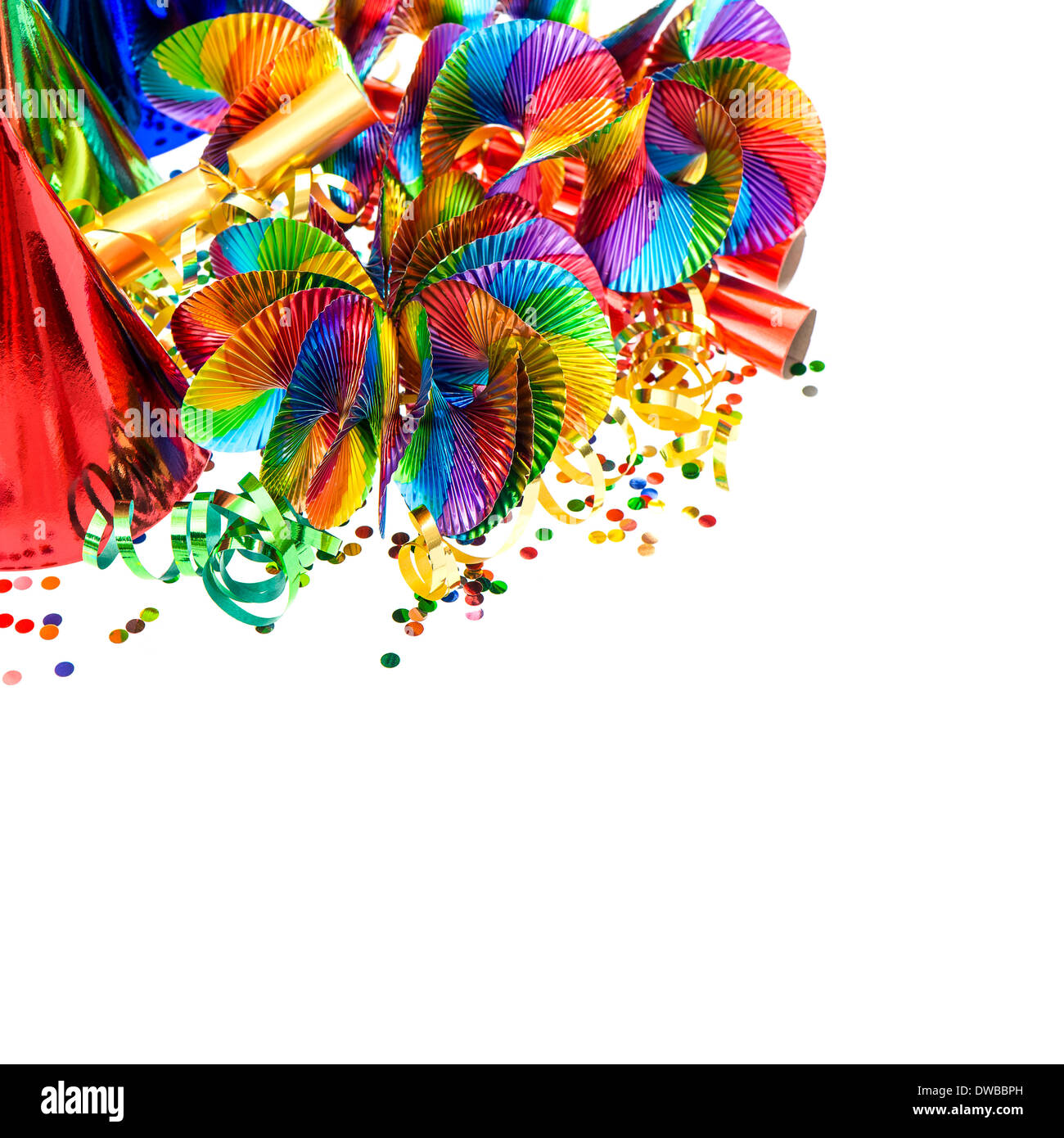 carnival decoration. garlands, streamer, party hats and confetti on white. colorful holidays background Stock Photo