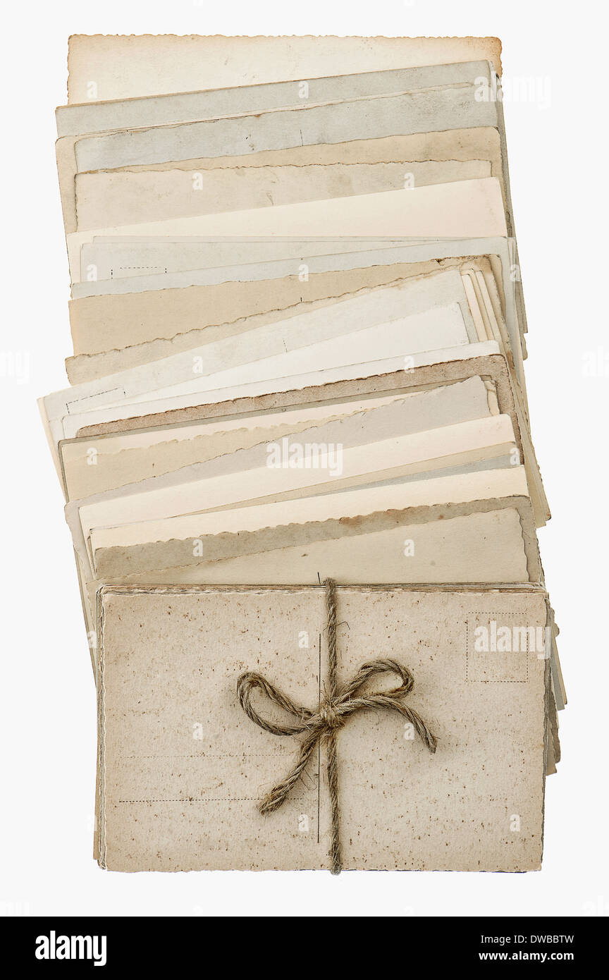 postcards isolated on white background. pile of old blank paper cards. vintage style picture Stock Photo