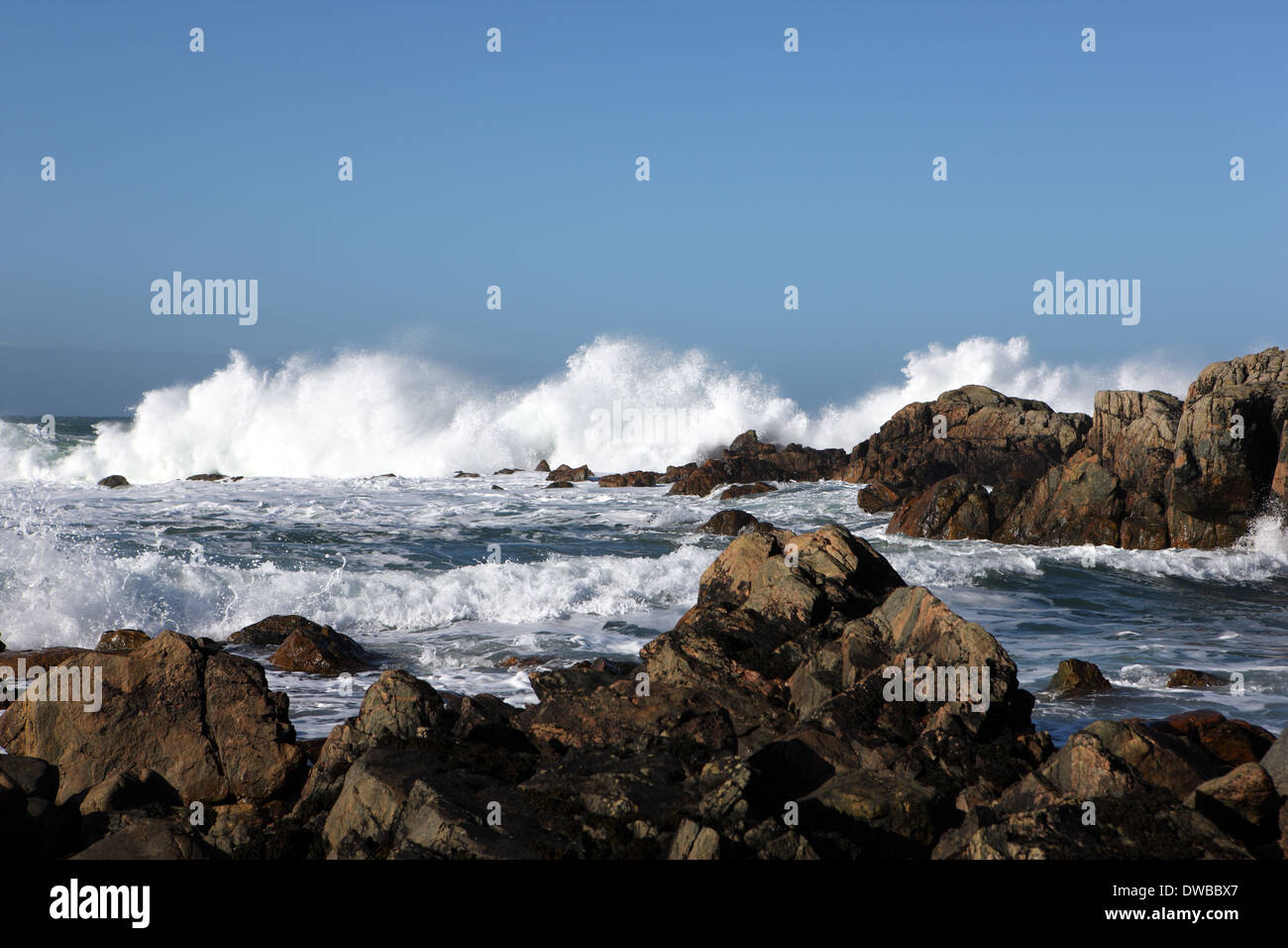 Waves crashing on the rocks on a beach in Iona one of the islands in the Inner Hebrides of Scotland Stock Photo