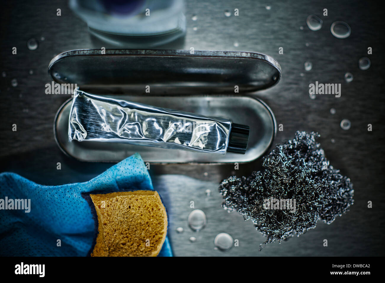 Cleaning paste, steel wool, stainless steel cleaner and sponges Stock Photo
