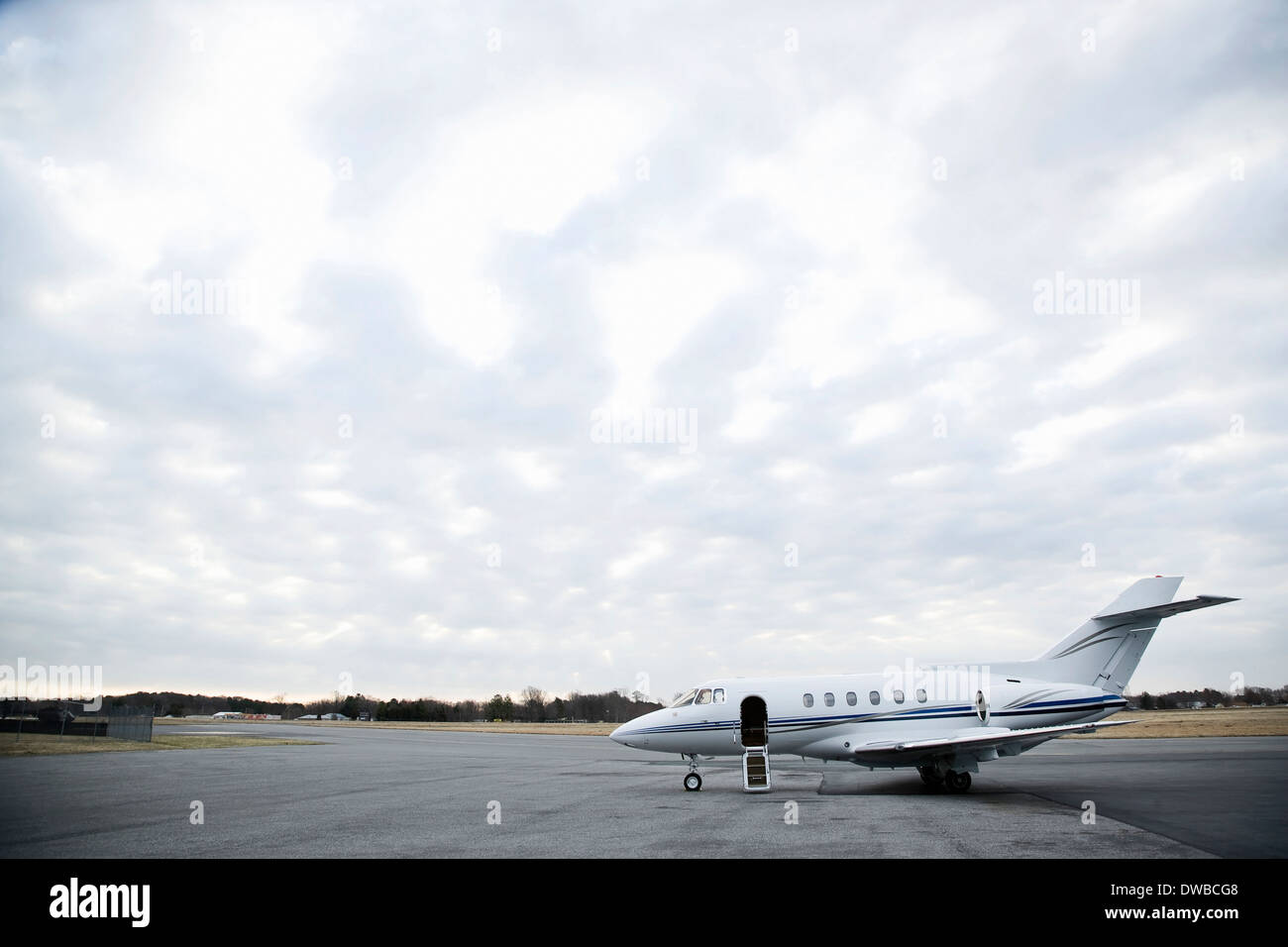 Stationary private jet on airport runway Stock Photo Alamy