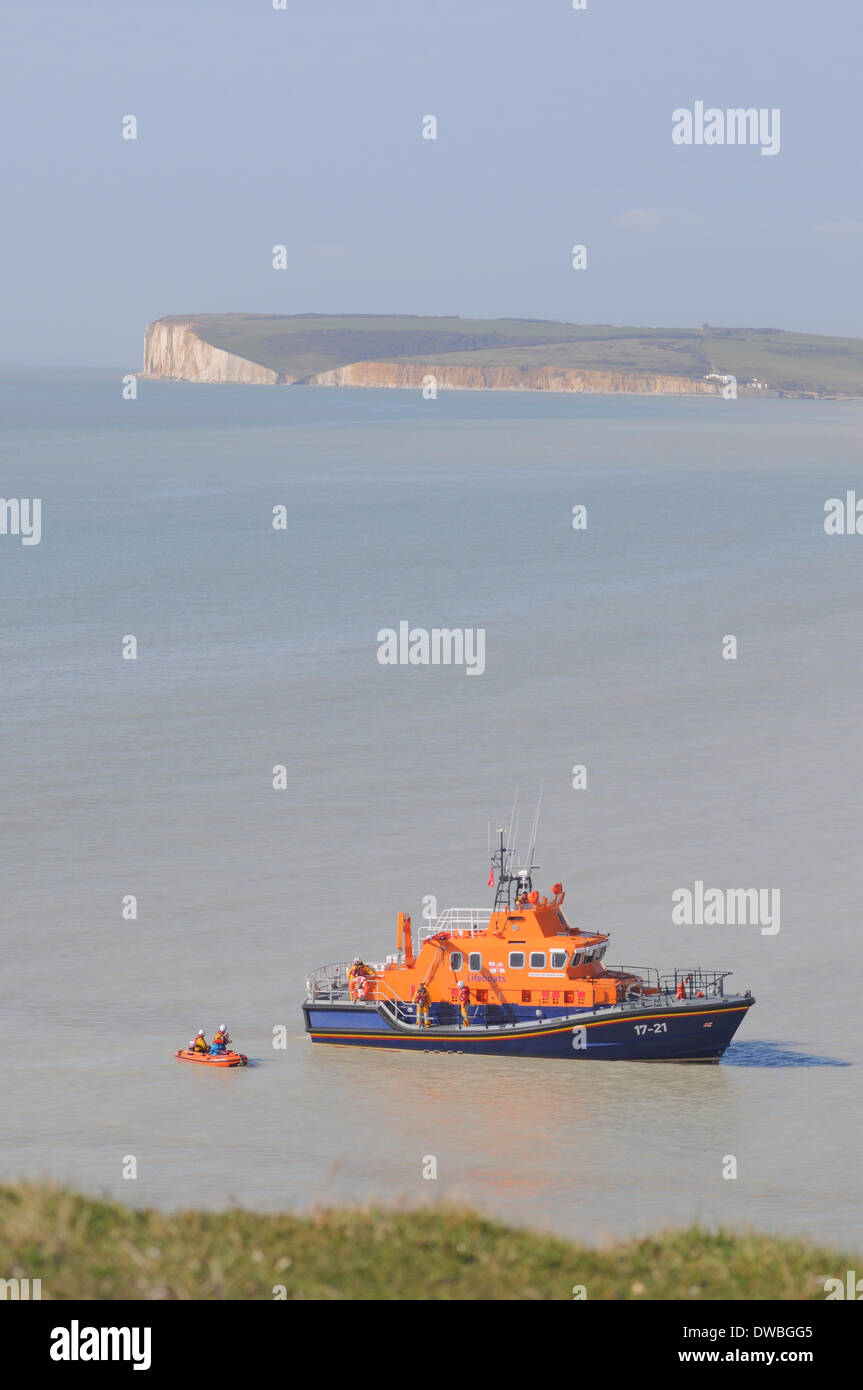 Birling Gap, East Sussex, UK. 5th March 2014. Newhaven lifeboat crews rescue young woman from beach after she was trapped by rising tide.David Burr/Alamy Live News Stock Photo