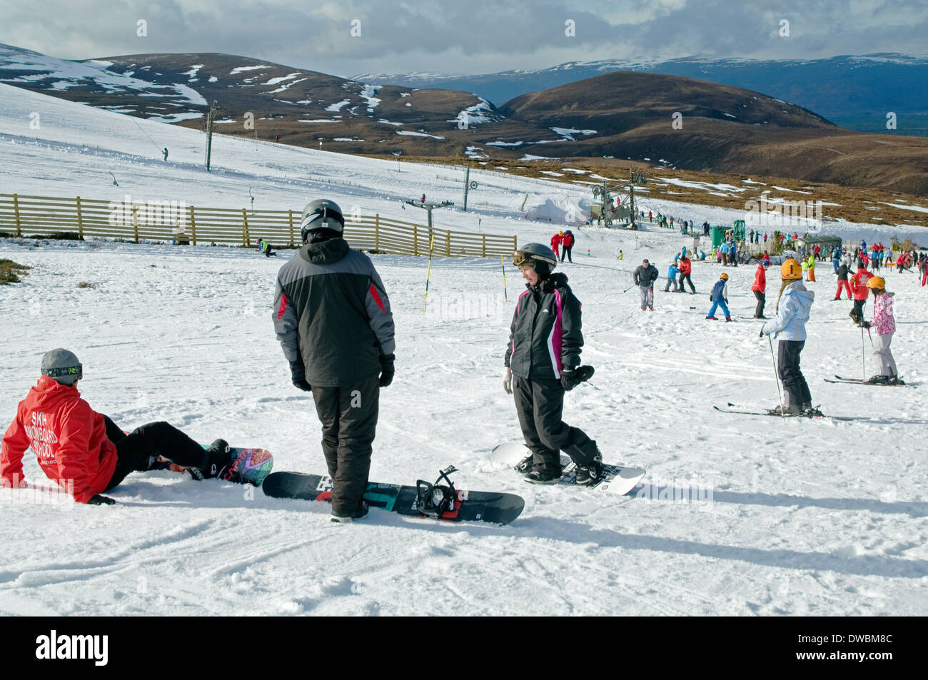 People having skiing and snowboarded lessons at Cairngorm Mountain Ski Centre, by Aviemore, Scottish Highlands, Scotland UK Stock Photo