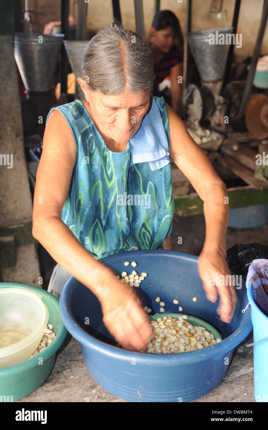 Woman knead corn for tortilla paste at Suchitoto on El Salvador Stock